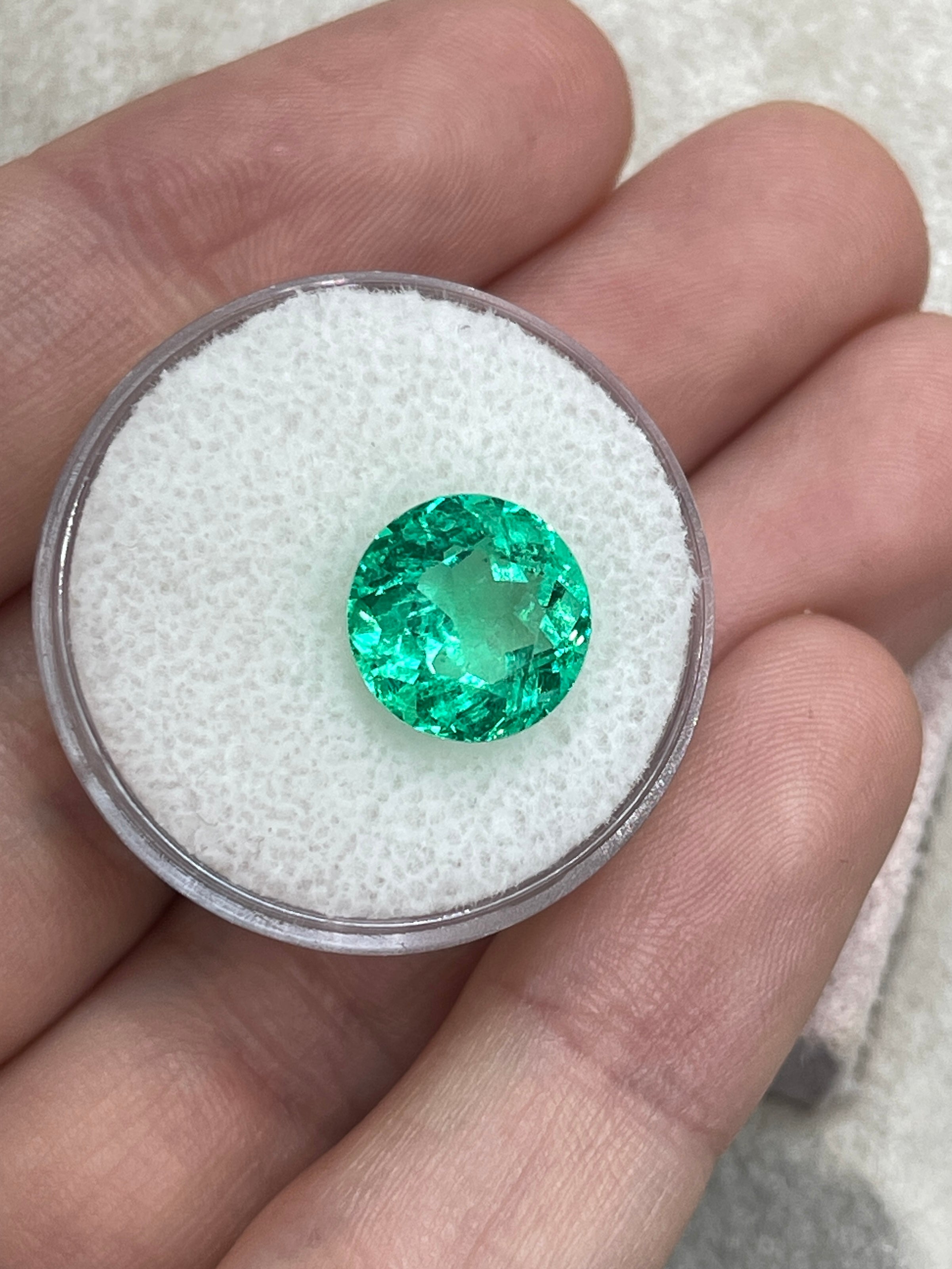 Vibrant green natural round Colombian emerald, 4.57 carats, 10.6x10.6mm, with crystalline clarity from JR Colombian Emeralds