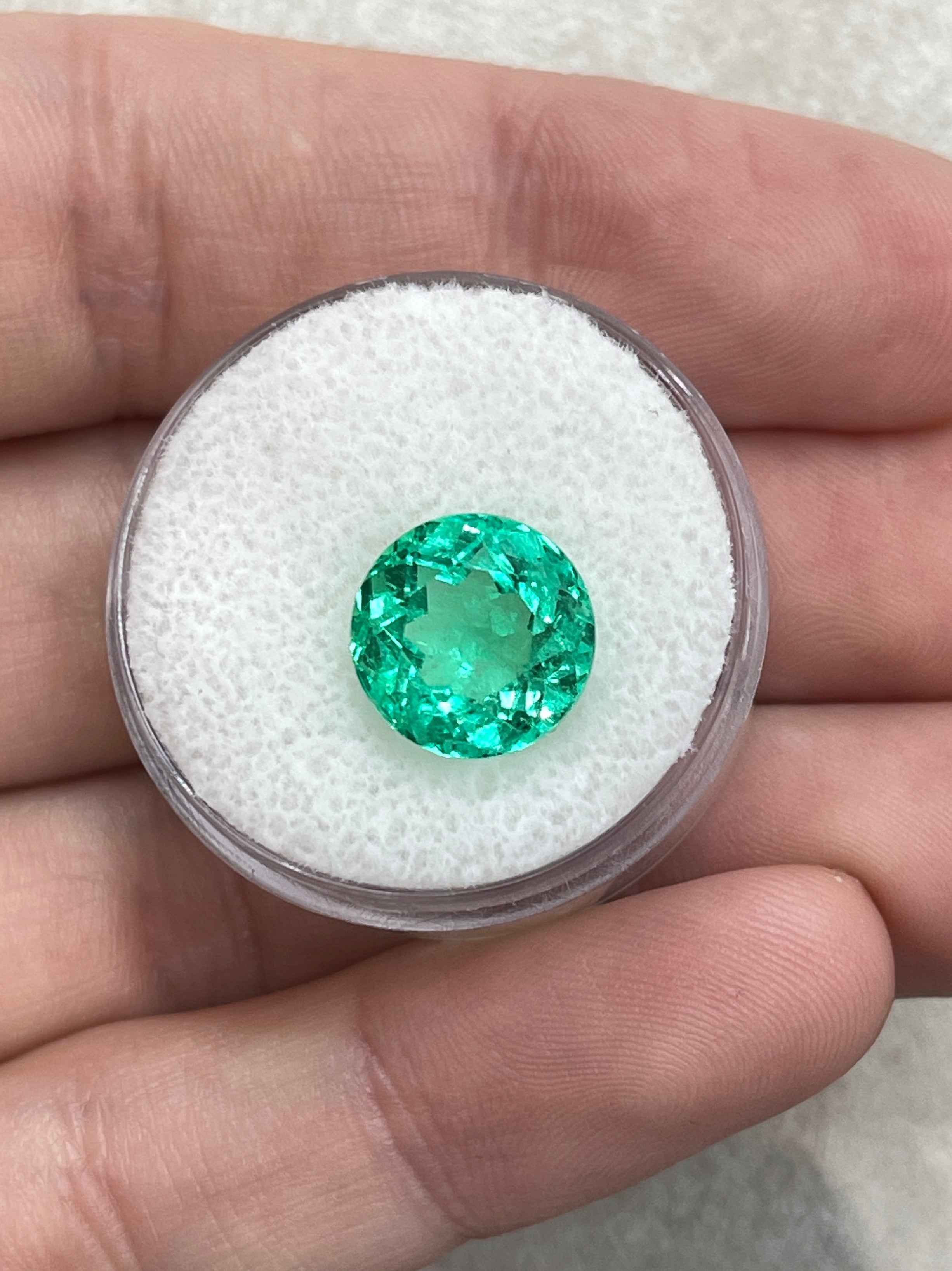 Vibrant green 4.57 Carat round Colombian emerald with crystalline clarity, natural gemstone from JR Colombian Emeralds.