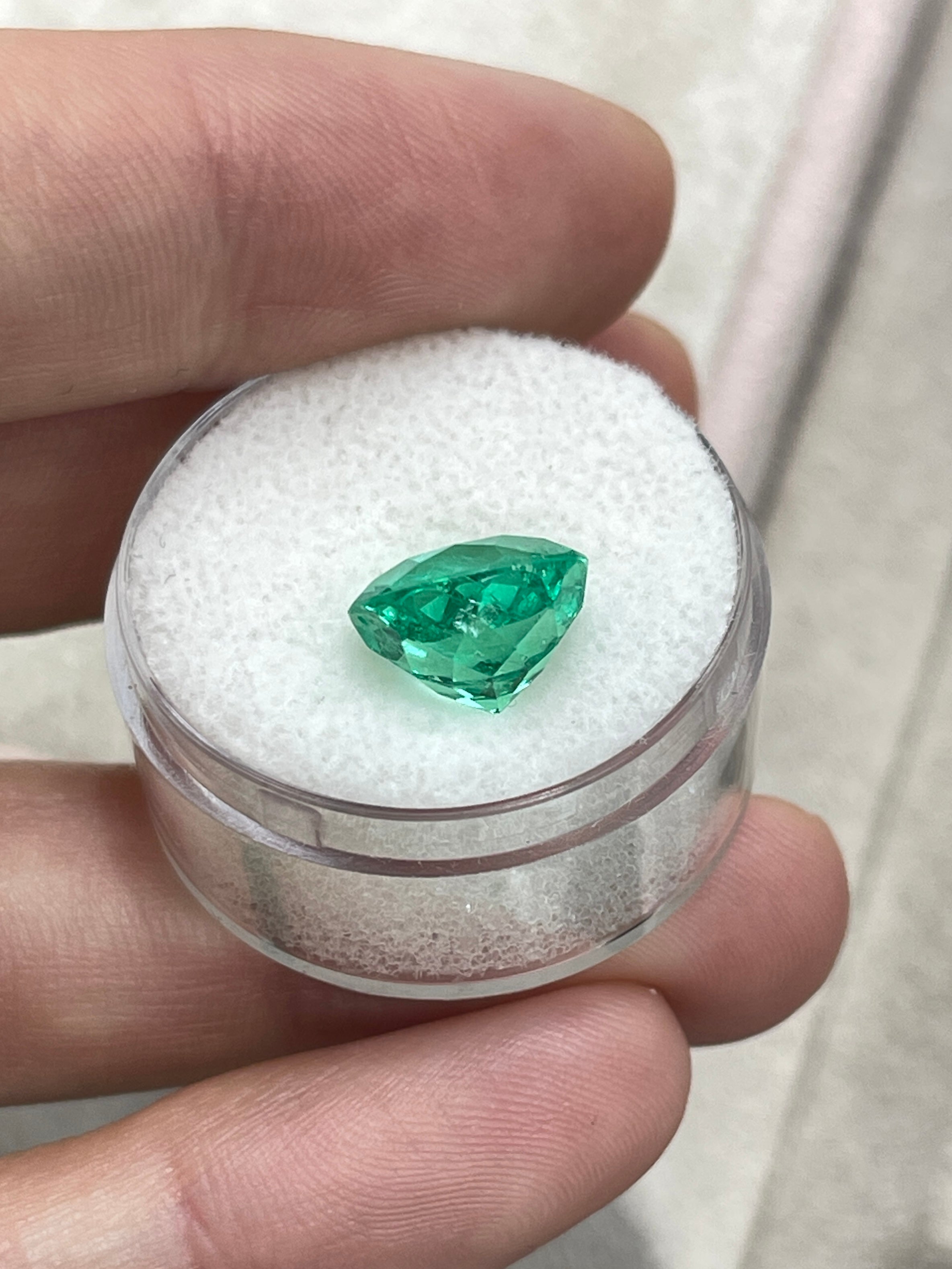 Vibrant green 4.57 carat round Colombian emerald with crystalline clarity, natural gemstone from JR Colombian Emeralds.