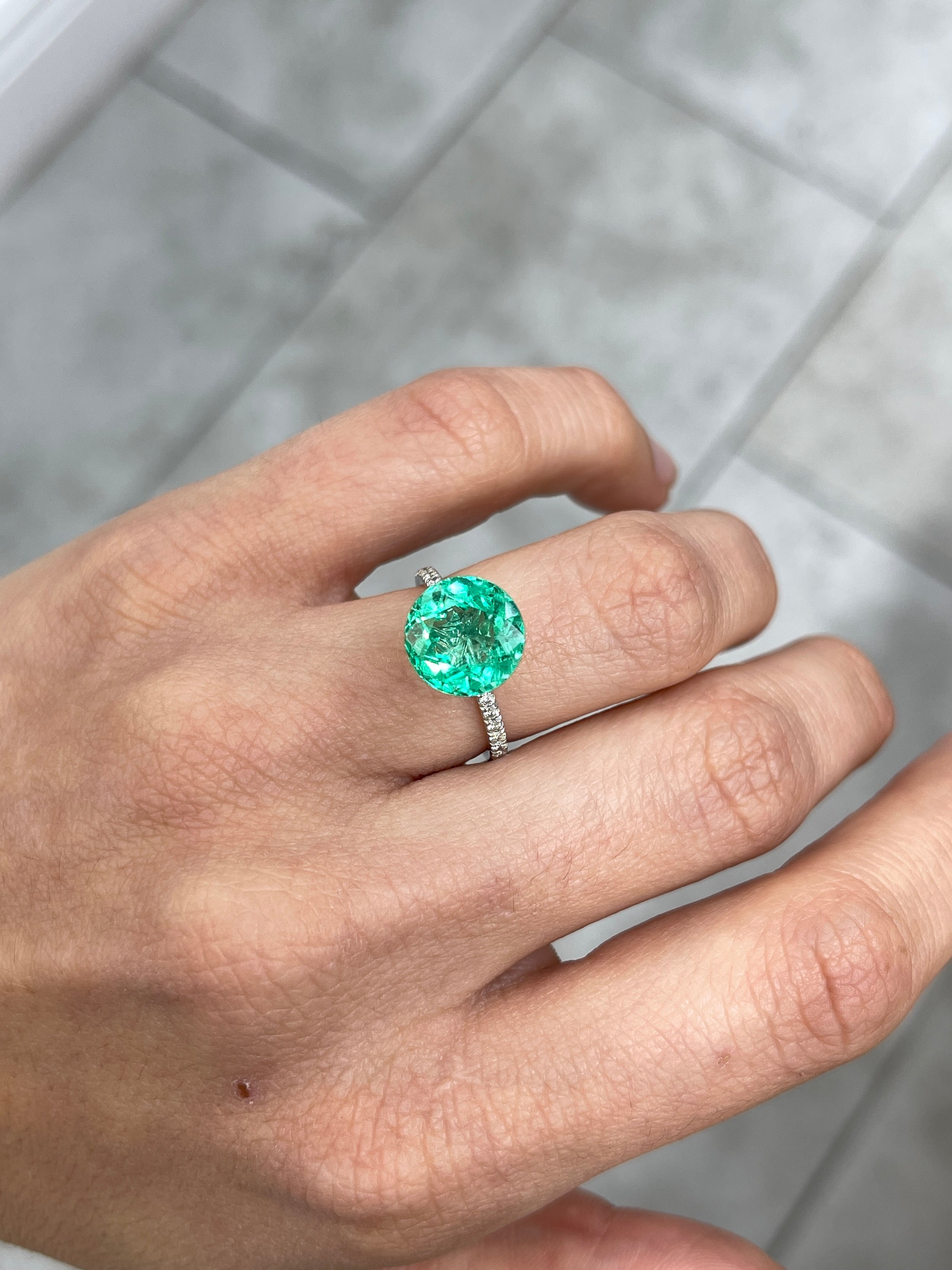 Vibrant green natural round Colombian emerald, 4.57 carats, crystalline clarity, 10.6x10.6mm, from JR Colombian Emeralds.