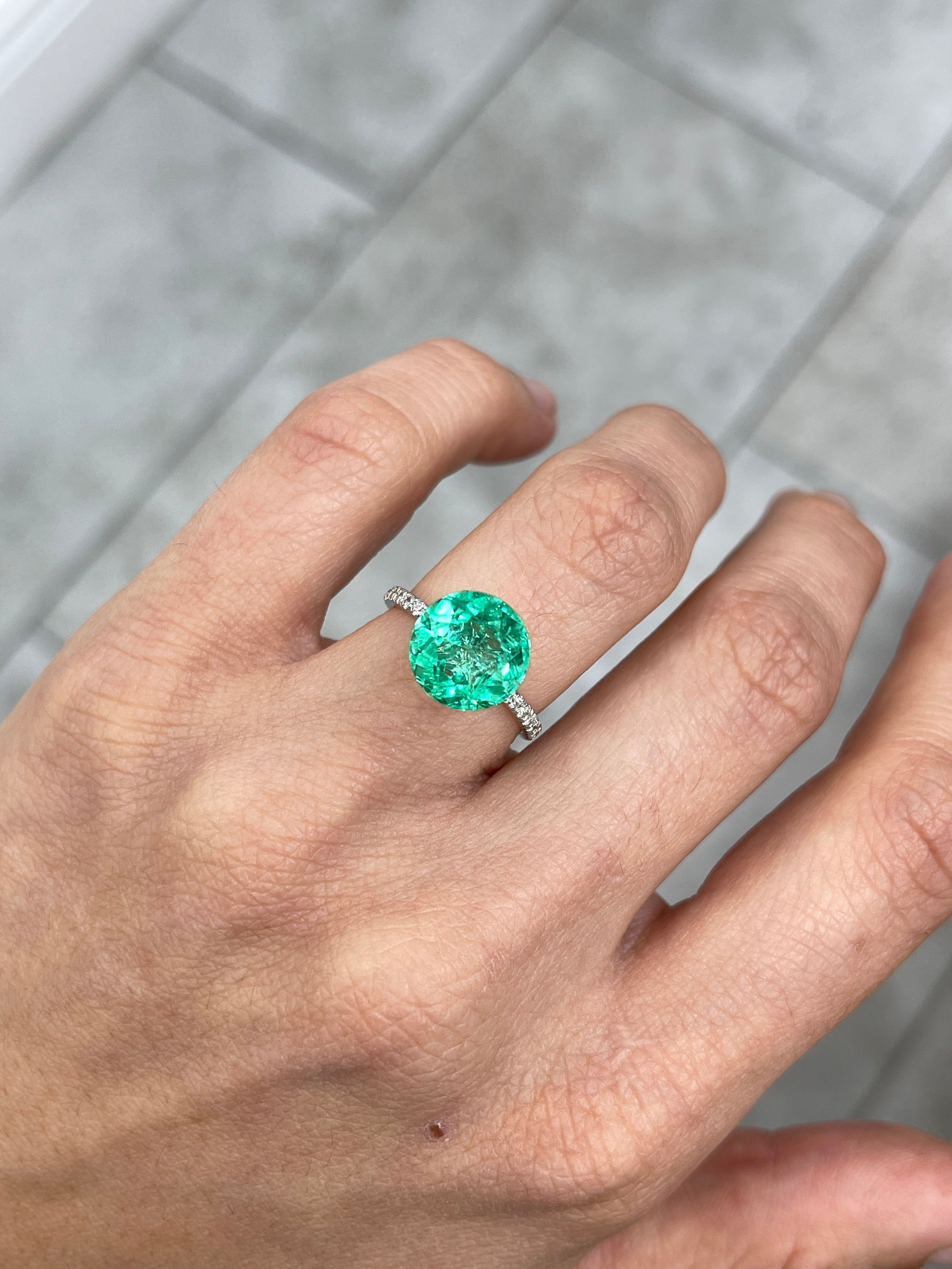 Vibrant green natural round Colombian emerald, 4.57 carats, 10.6x10.6mm, with crystalline clarity, from JR Colombian Emeralds.