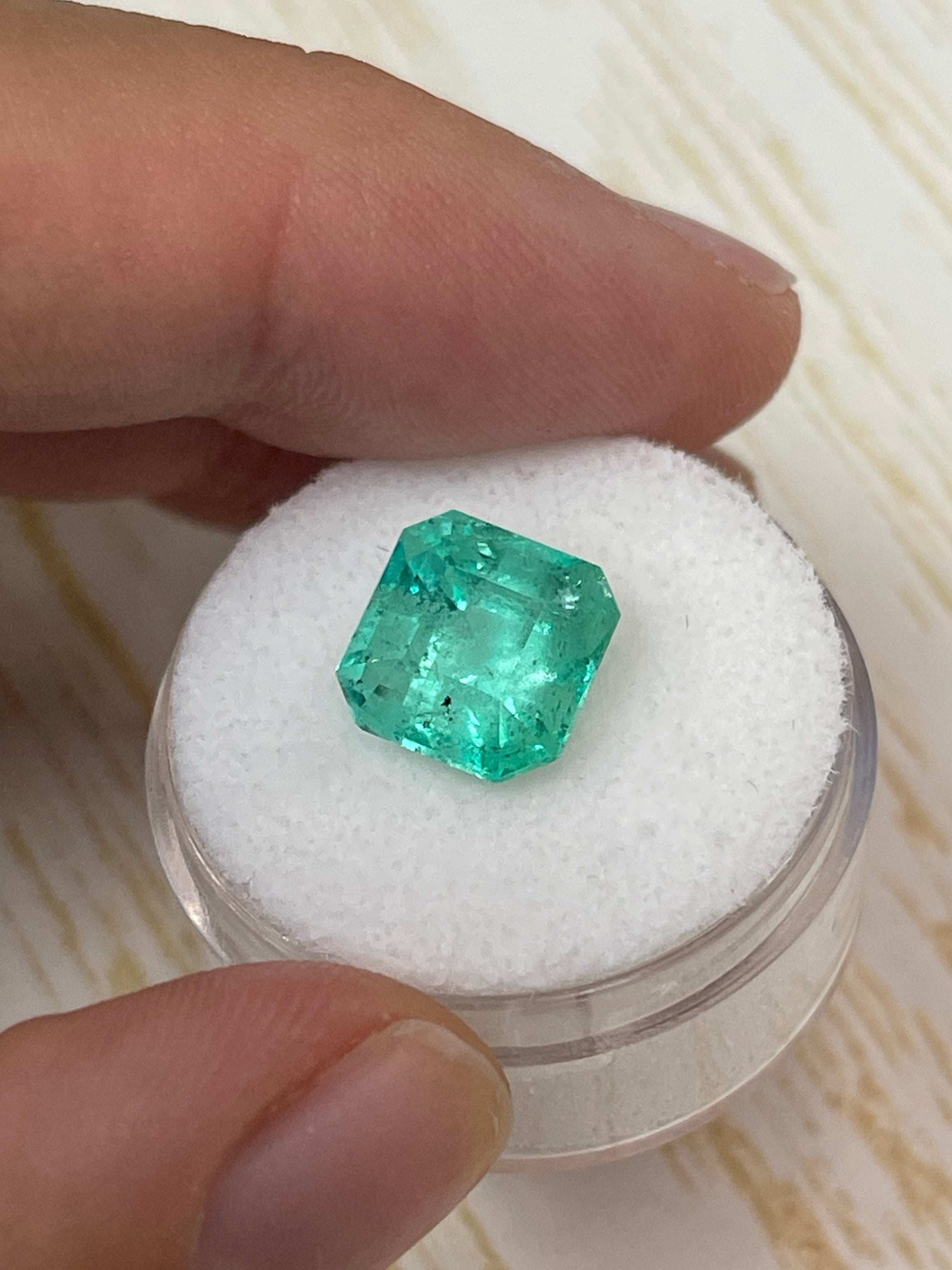 4.69-carat Colombian emerald loose gemstone, Asscher cut with clipped corners, featuring natural freckles, from JR Colombian Emeralds.