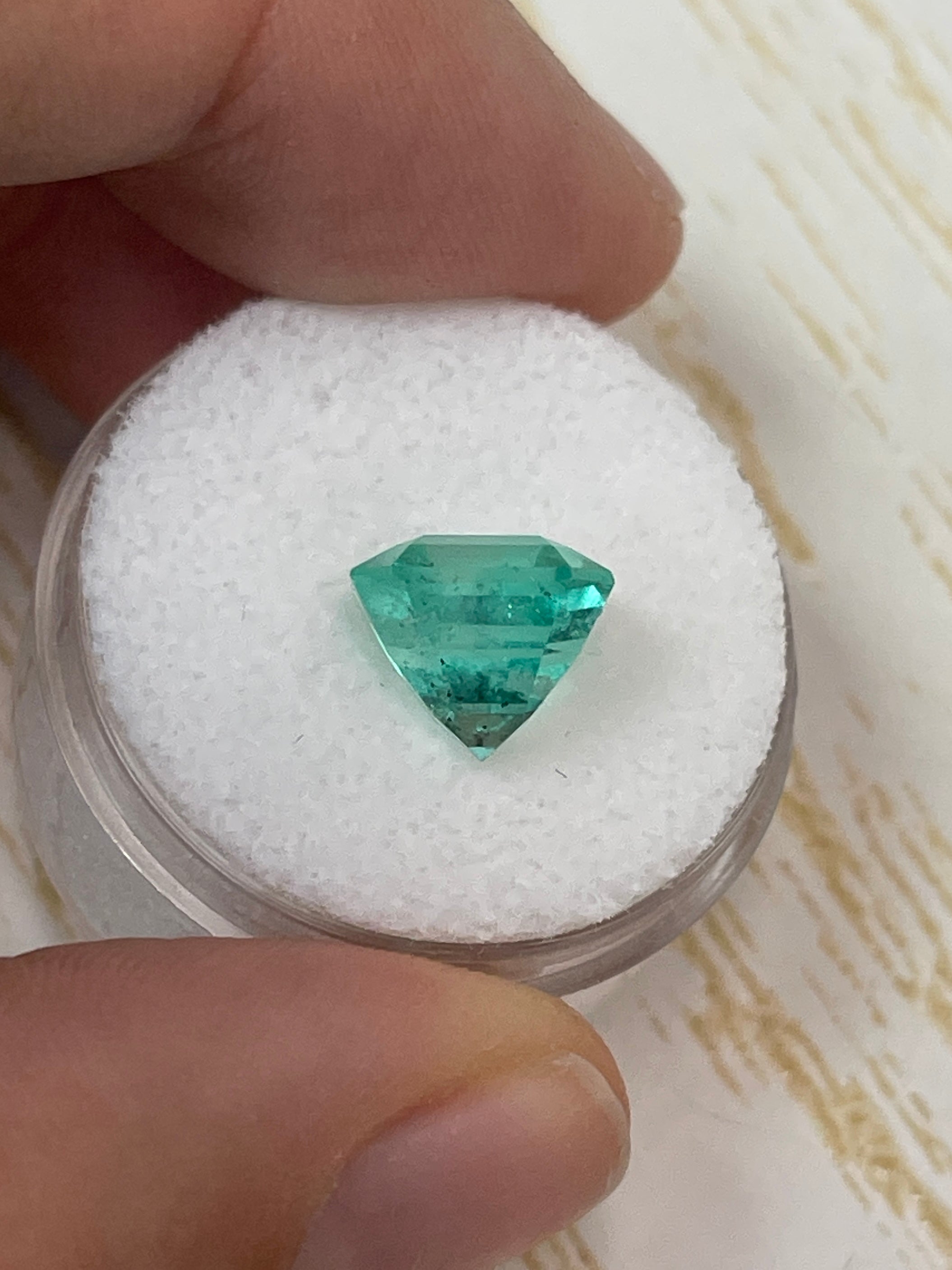 4.69 carat Colombian emerald loose gemstone, Asscher cut with clipped corners, featuring natural freckles, by JR Colombian Emeralds.