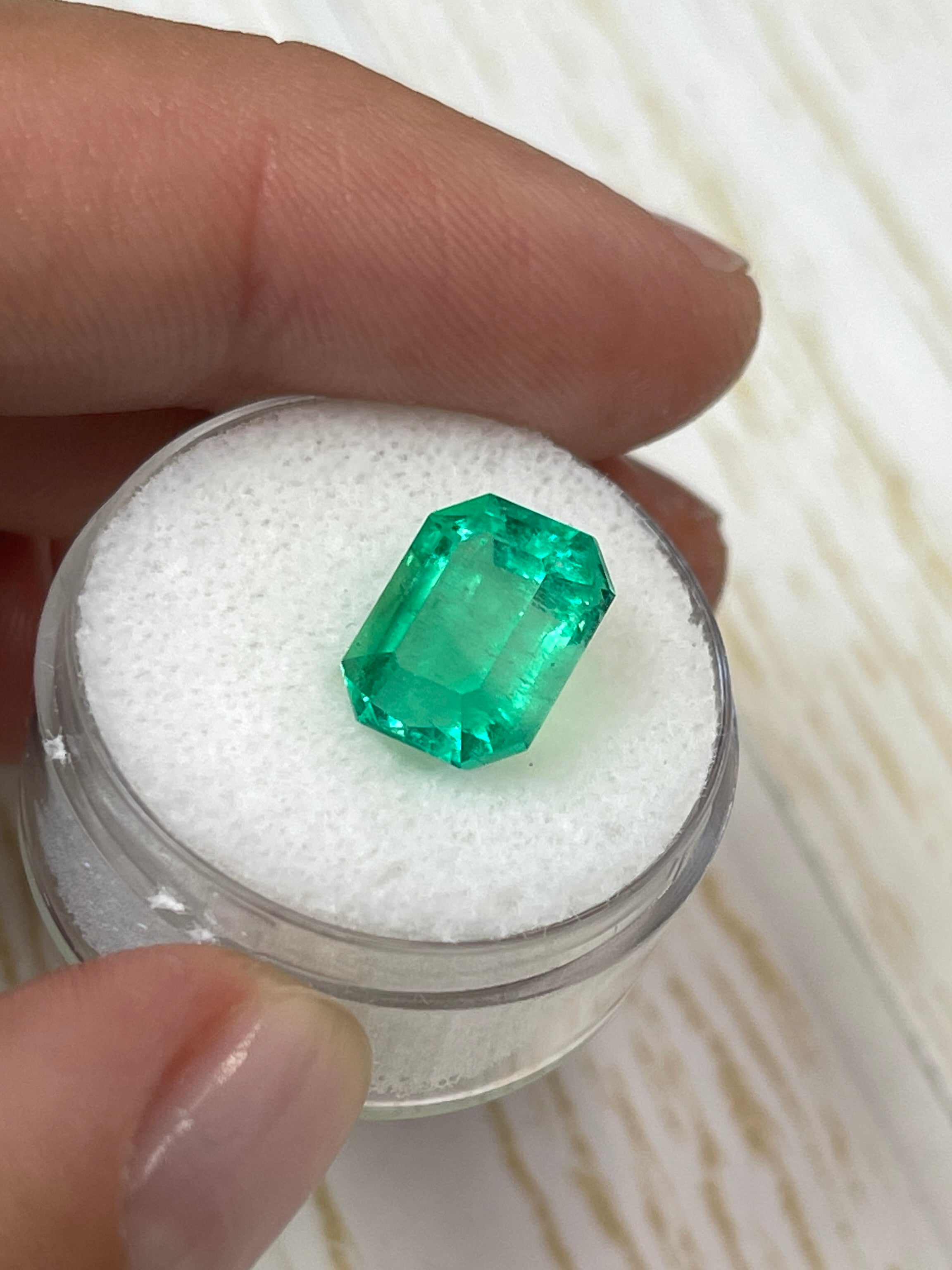 4.70 carat yellowish green natural Colombian emerald in classic emerald cut, loose gemstone from JR Colombian Emeralds.