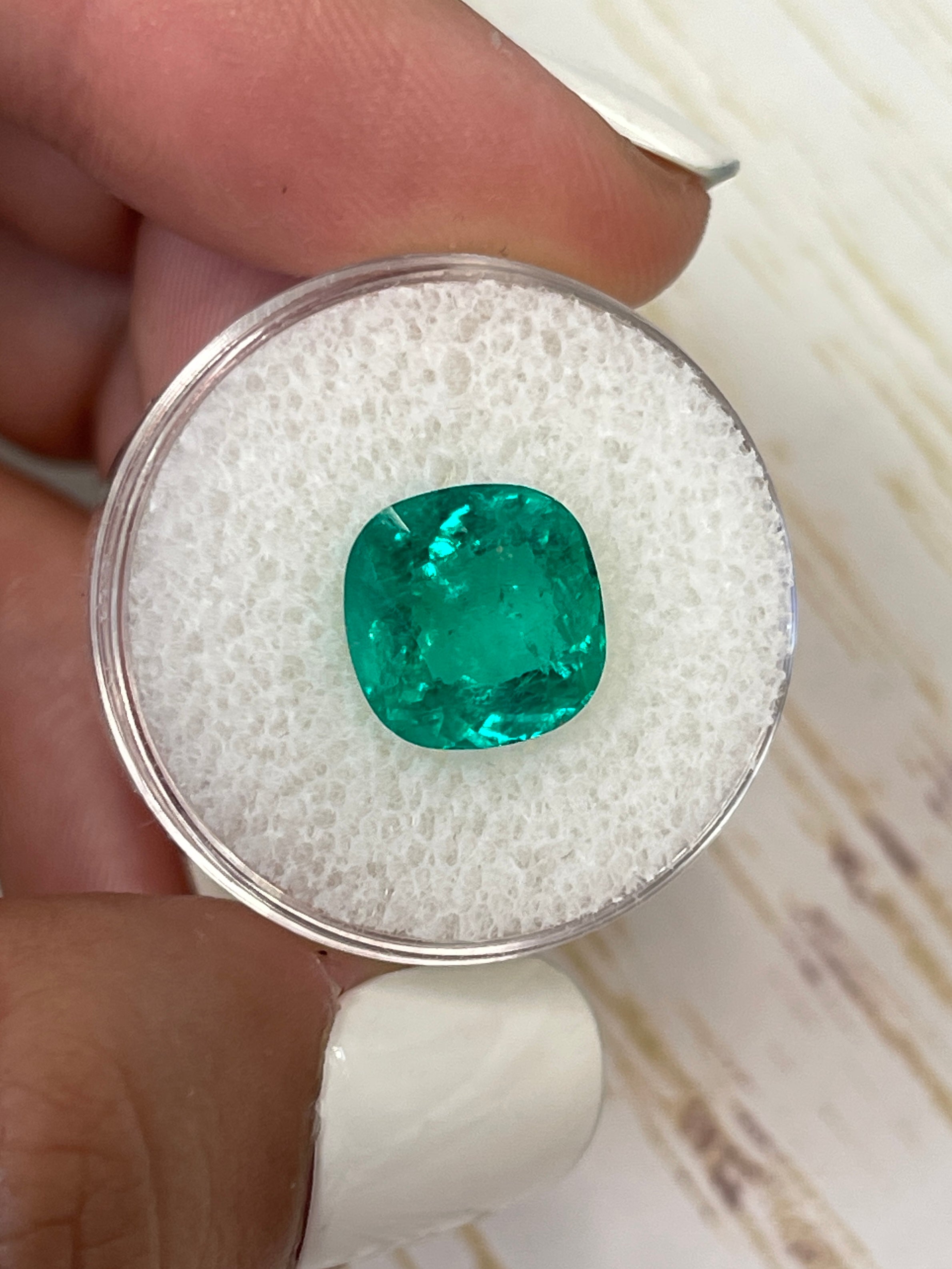 Vivid bluish-green 4.75 carat Colombian emerald in cushion cut, natural loose gemstone from JR Colombian Emeralds.