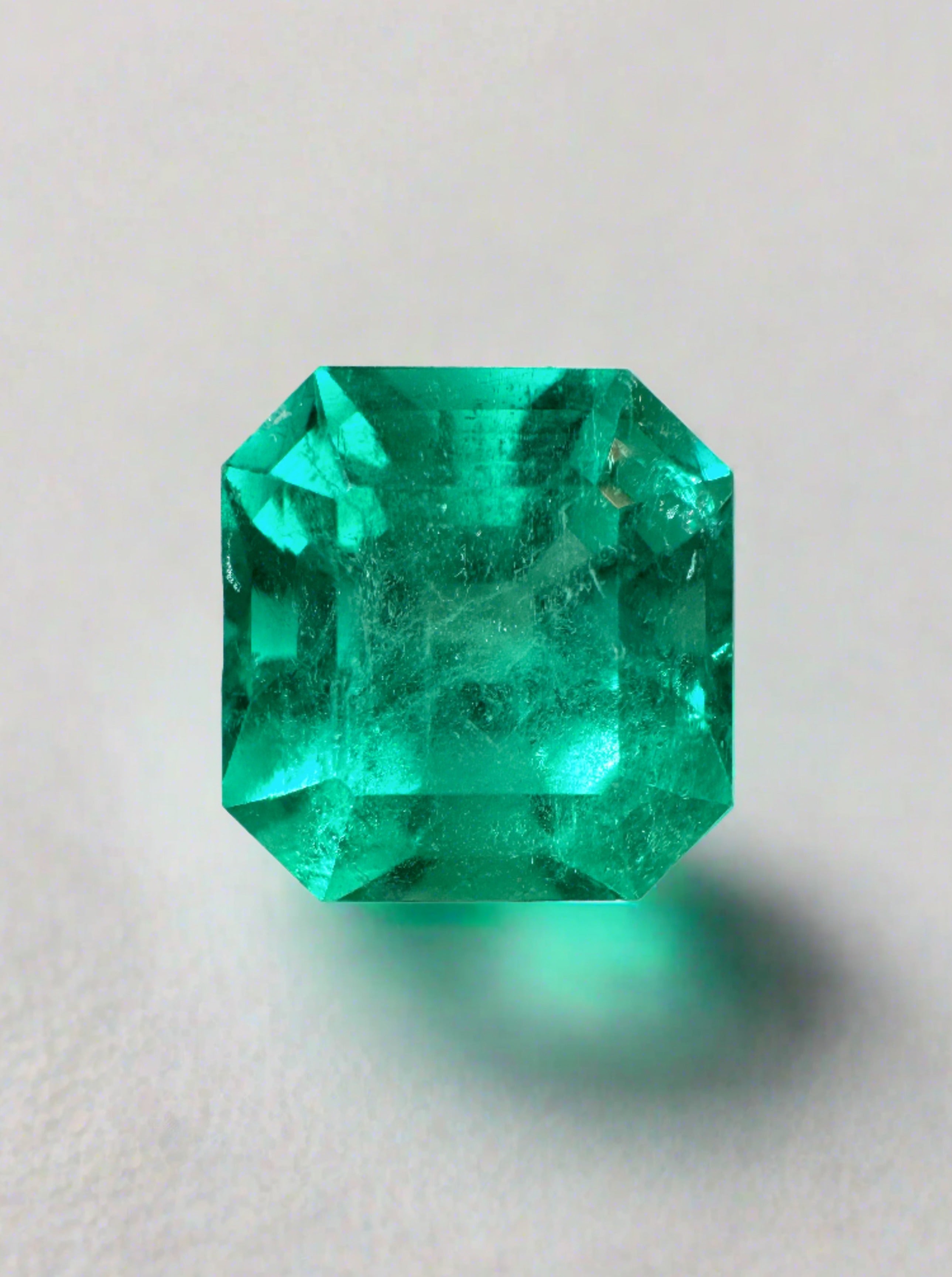Loose 4.83 carat bluish Colombian emerald Asscher cut gemstone, displayed with clarity and vibrant color.