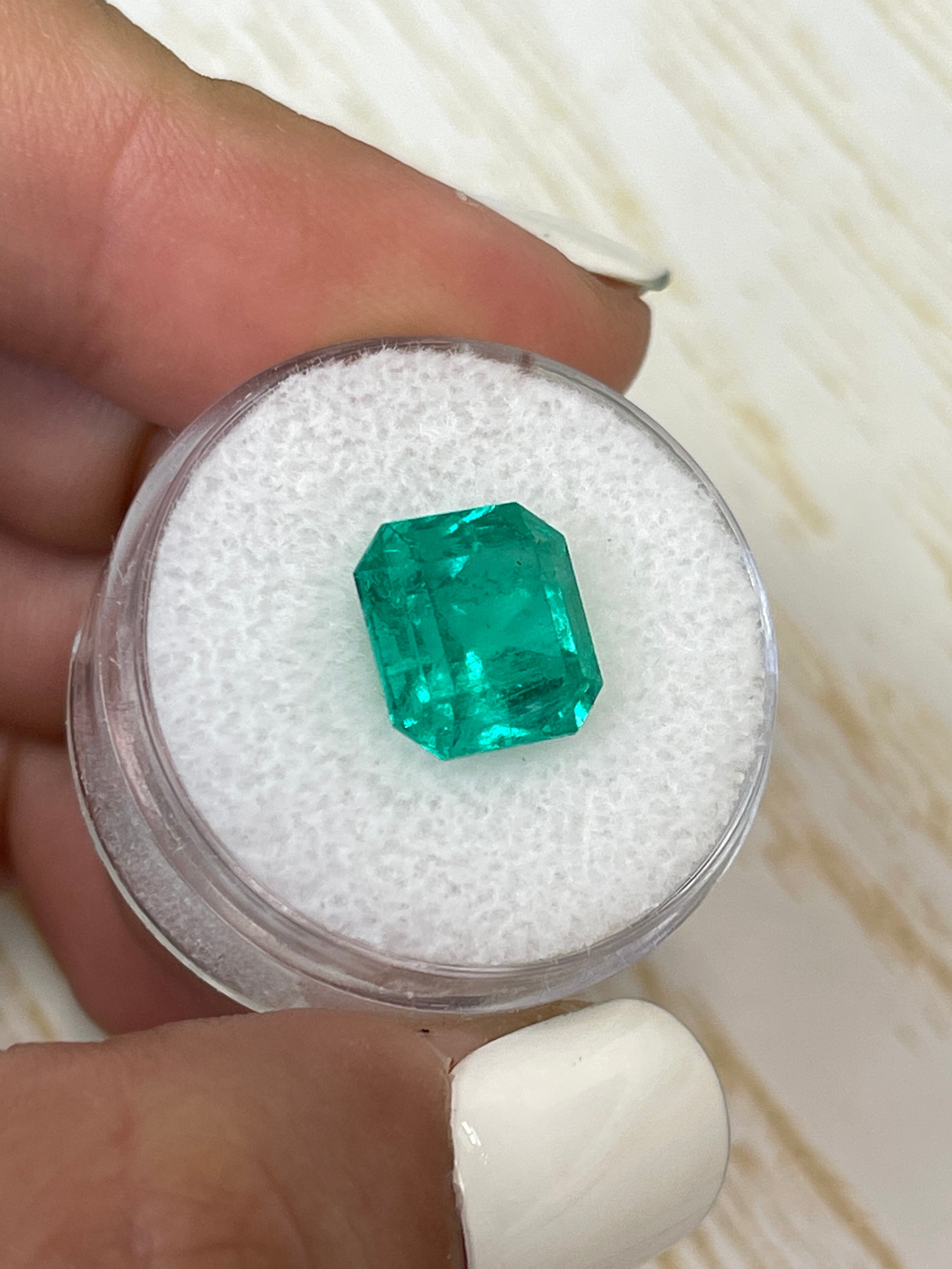 Vibrant 4.83 carat Colombian emerald loose gemstone, Asscher cut, showcasing rich green color and clarity by JR Colombian Emeralds.