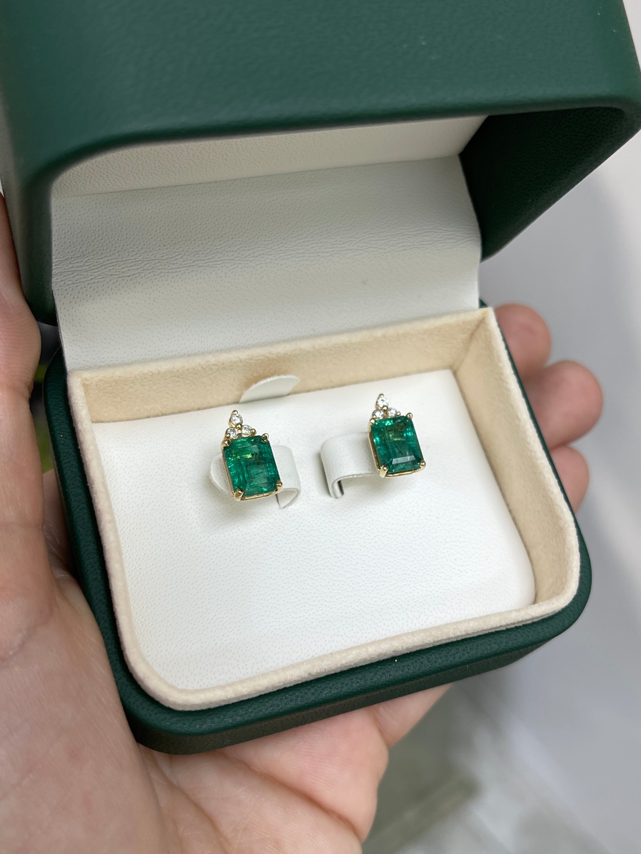14K green emerald and diamond accent stud earrings featuring 4.87tcw from JR Colombian Emeralds, close-up of sparkling jewelry.