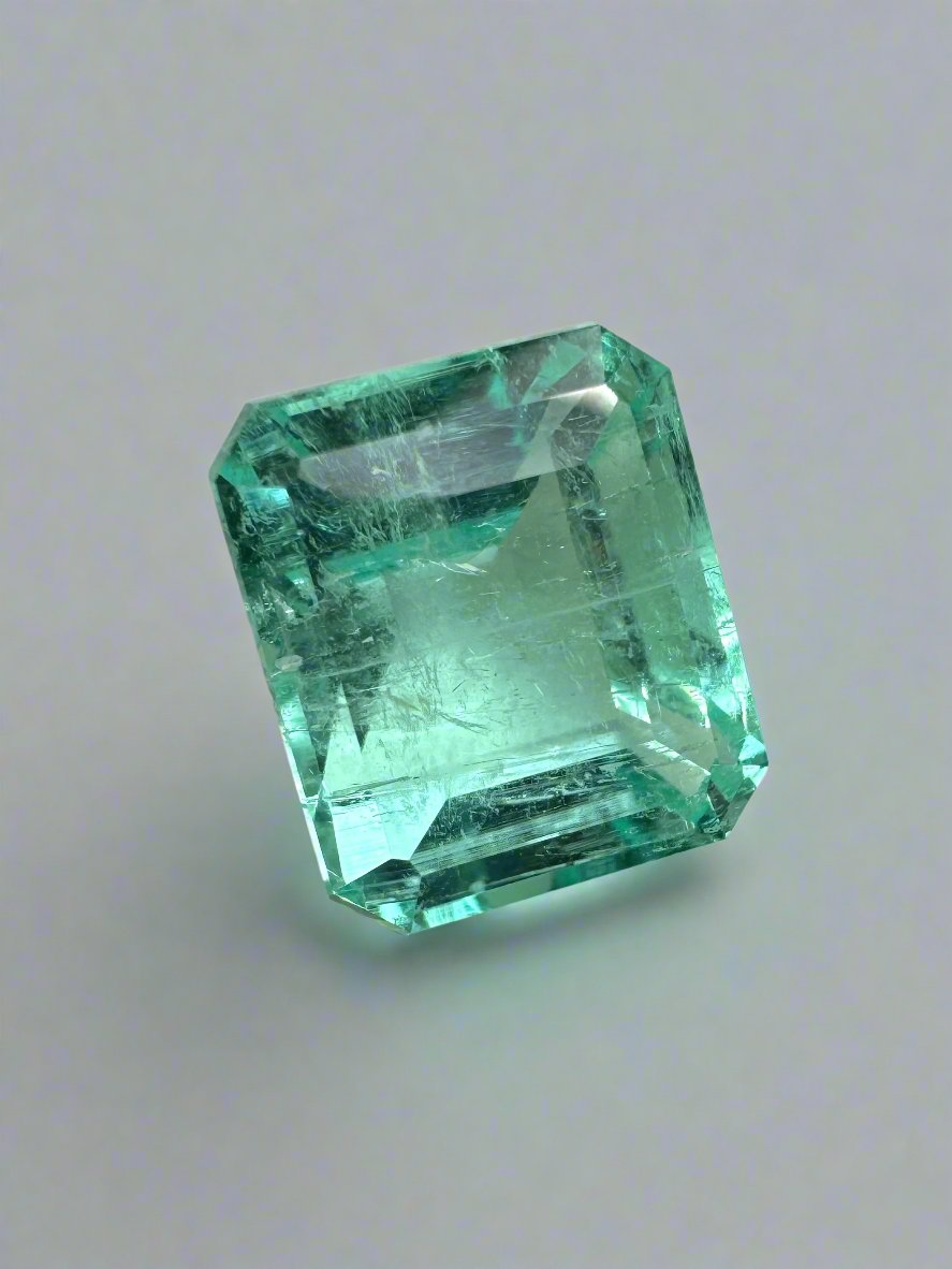 Large 4.91 carat natural Colombian emerald in 10x8.5 mm emerald cut, with pastel bluish green color, from JR Colombian Emeralds.