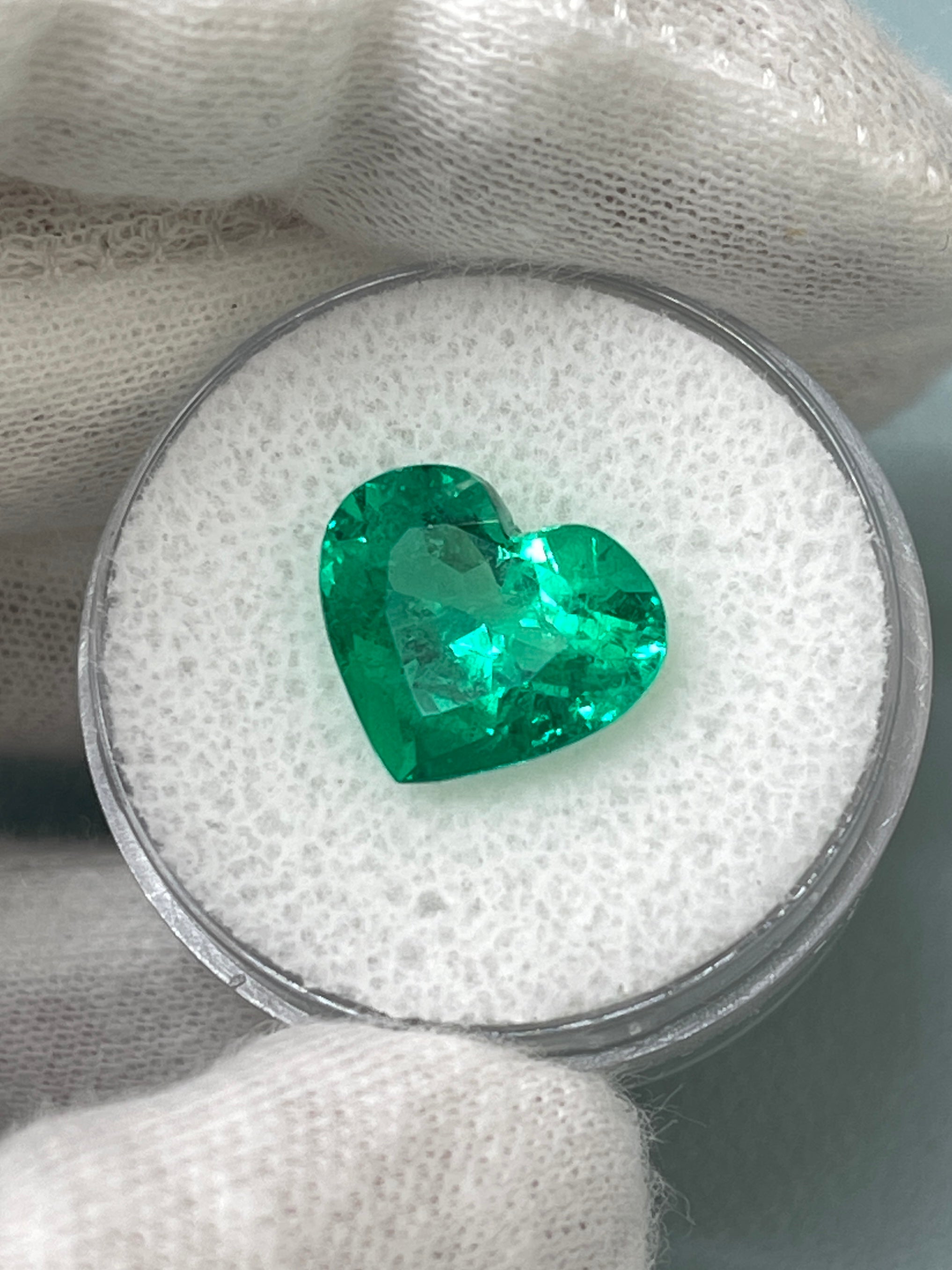 Vivid green 4.92 carat Colombian emerald loose heart cut gemstone, AAA+ quality, natural and radiant from JR Colombian Emeralds.