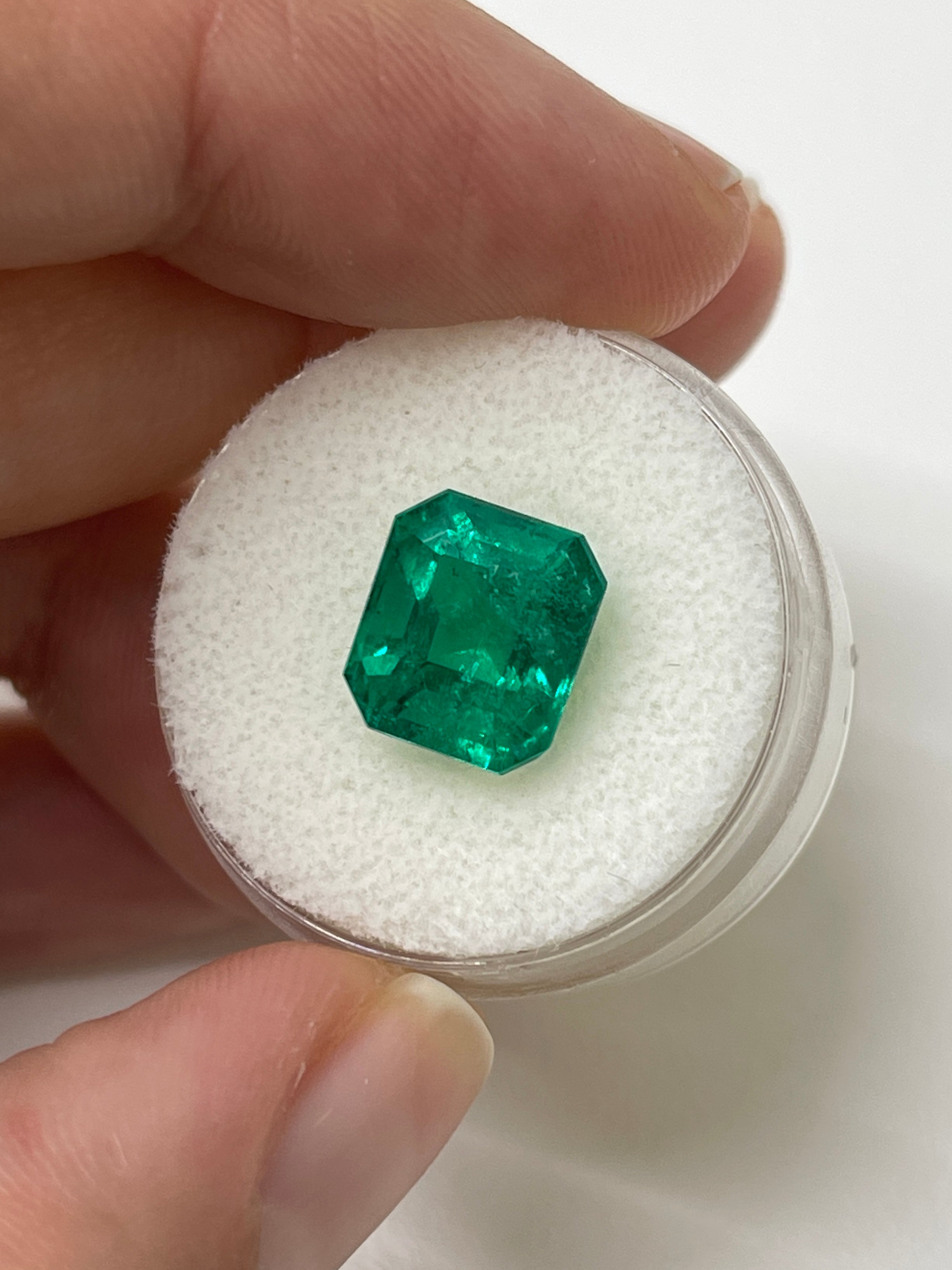 4.93 carat natural Colombian emerald cut loose gemstone from JR Colombian Emeralds, AAA+ investment grade, vivid green color.