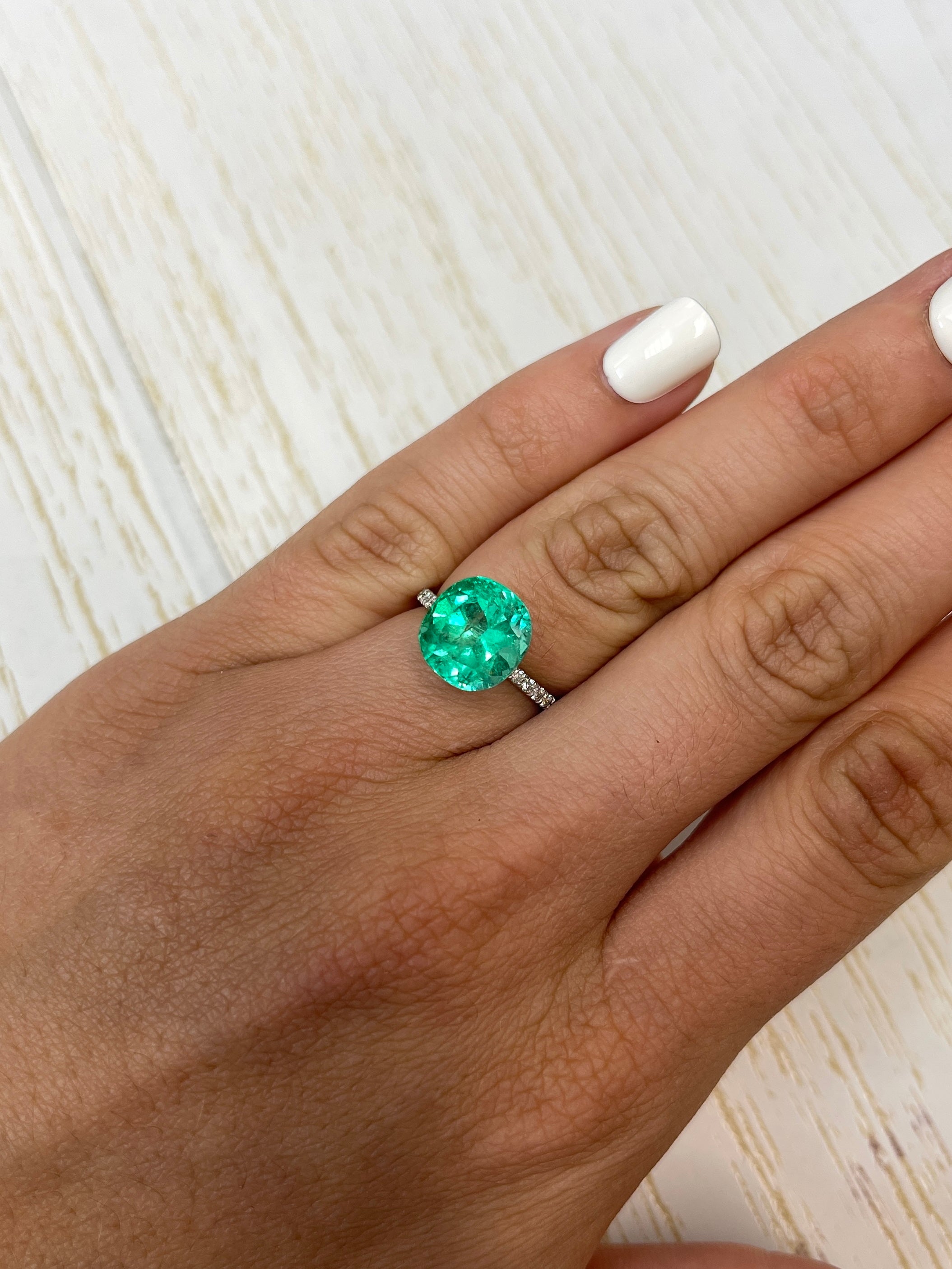 4.94-carat natural Colombian emerald loose cushion cut gemstone with vibrant green color, from JR Colombian Emeralds.