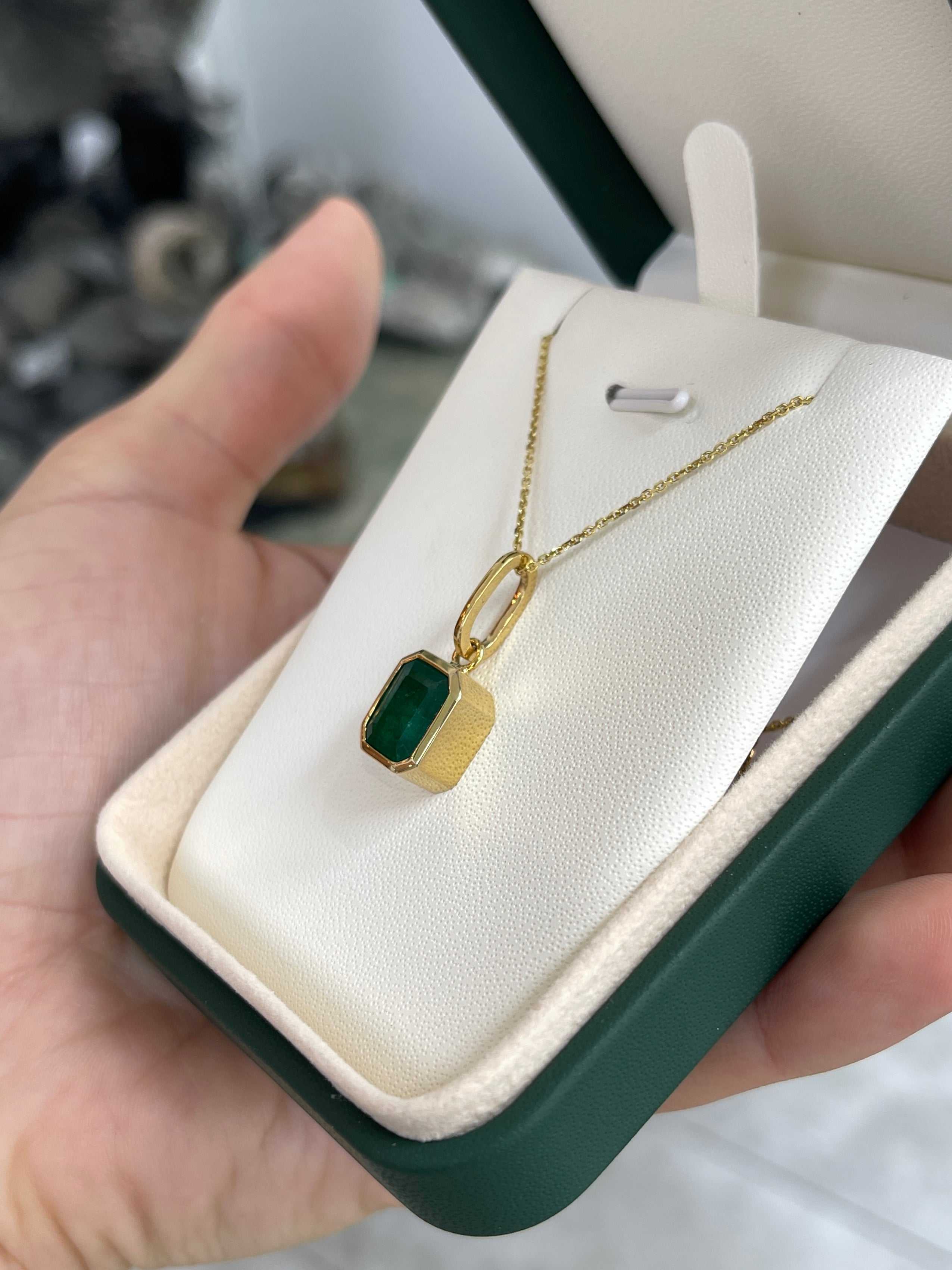 4.98 carat dark green Zambian emerald necklace with bezel setting in 14K gold, featuring a jewelry design from JR Colombian Emeralds.