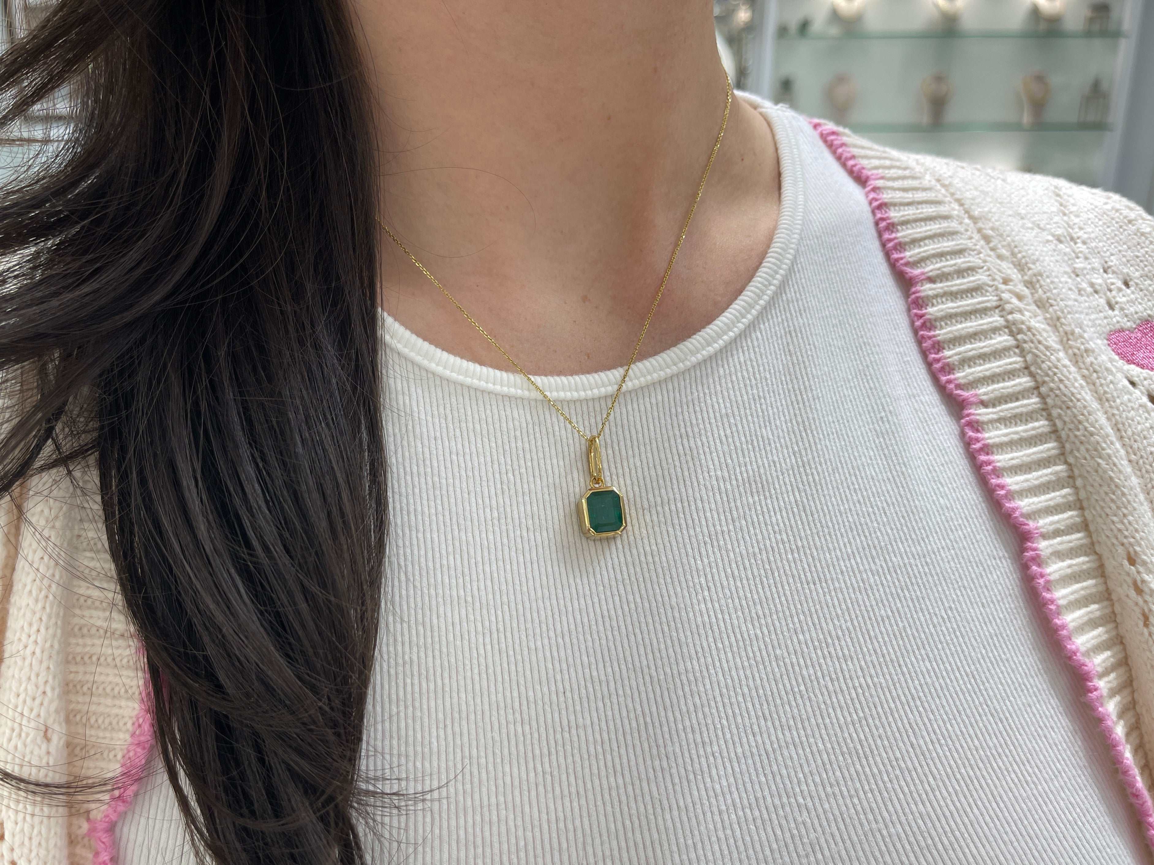 Dark green Zambian emerald necklace with a 4.98 carat bezel set gemstone on 14K gold, by JR Colombian Emeralds.