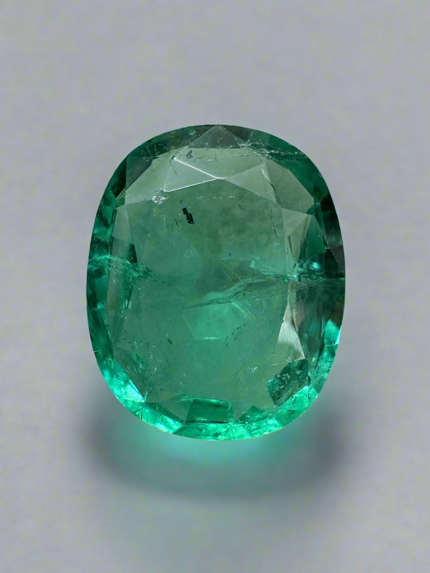 5.09 Carat natural Zambian emerald loose gemstone with bubbly hybrid cushion and oval cut, by JR Colombian Emeralds.