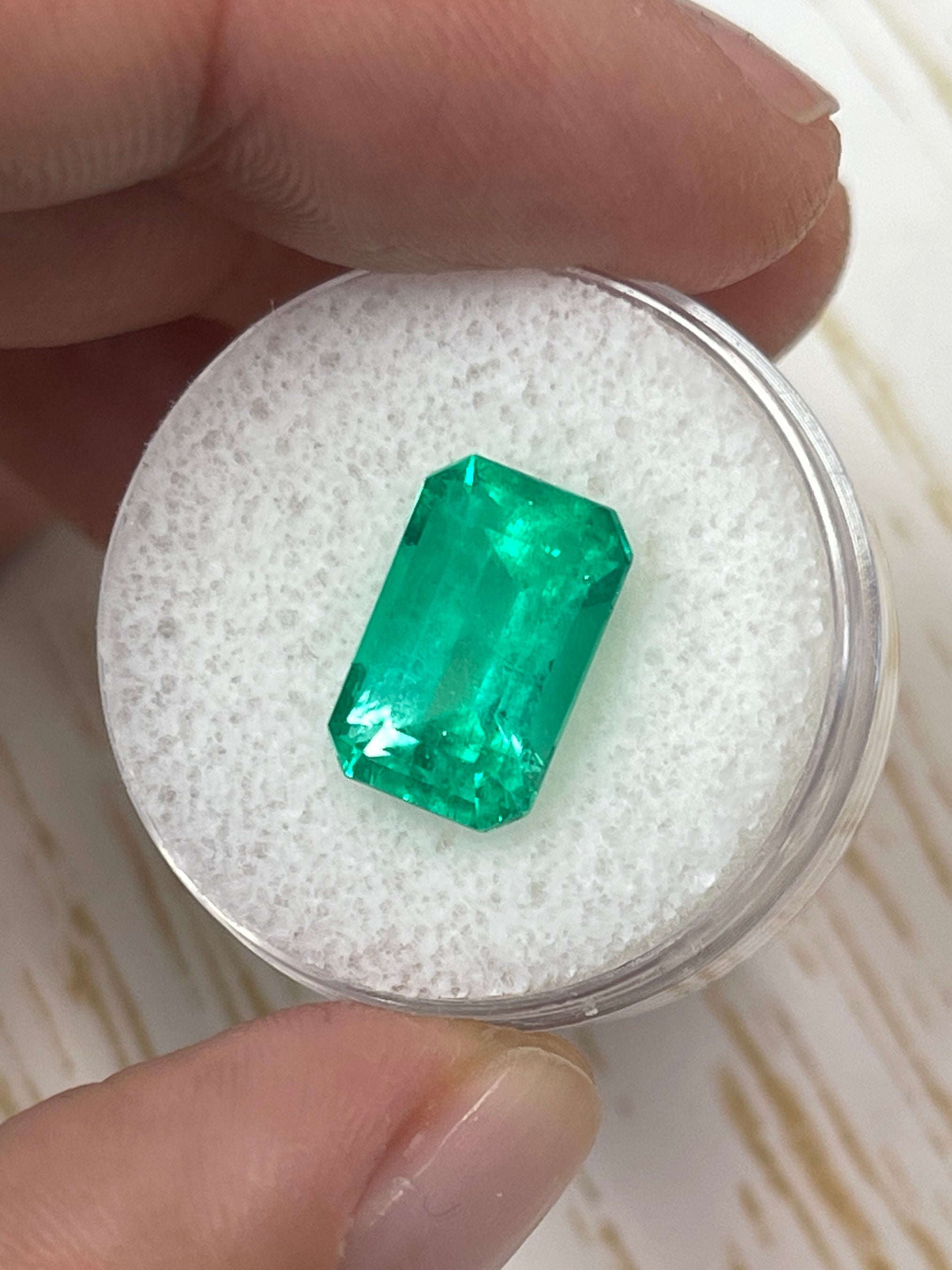 Yellowish green 5.26 carat Colombian Emerald in an emerald cut, natural loose gemstone from JR Colombian Emeralds.