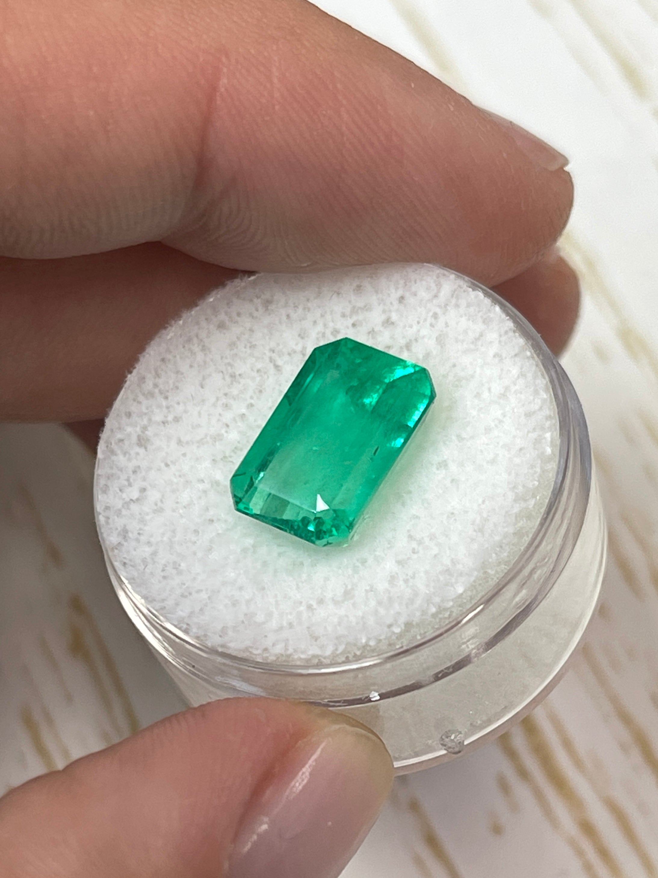 Natural 5.26 carat yellowish green Colombian emerald loose gemstone in an emerald cut, from JR Colombian Emeralds.