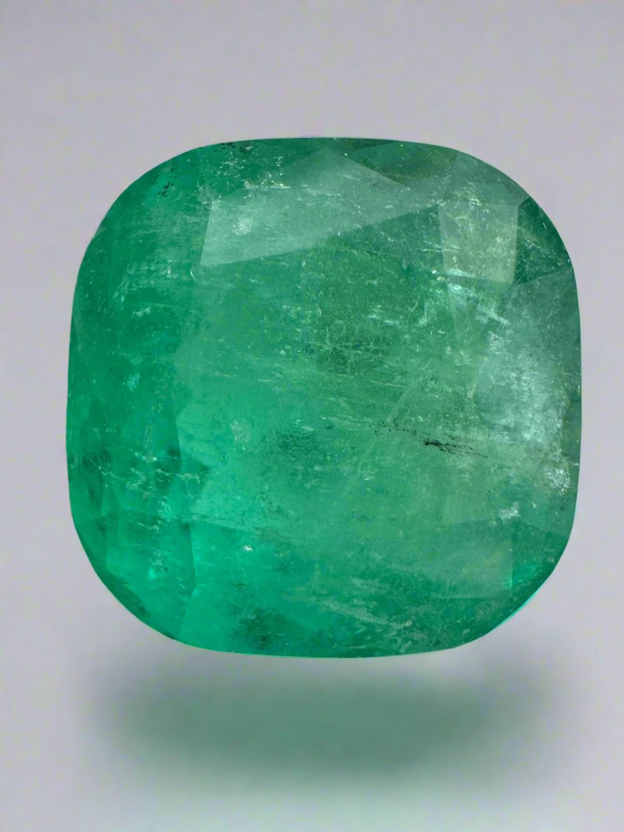 Loose 5.33 carat earthy Colombian emerald in cushion cut, measuring 10.8x10.7mm, from JR Colombian Emeralds.