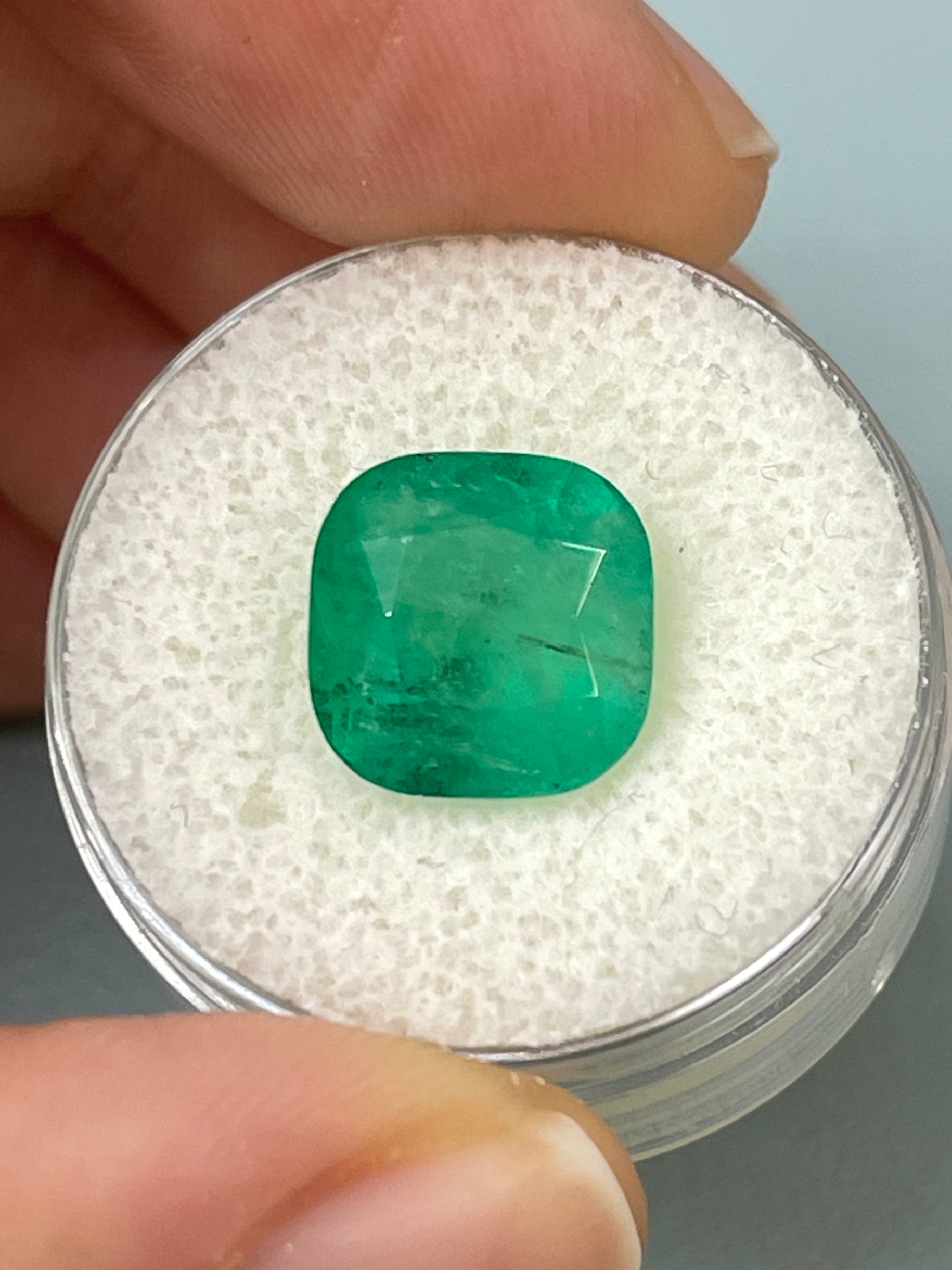 5.33 carat earthy natural Colombian emerald cushion cut loose gemstone from JR Colombian Emeralds.