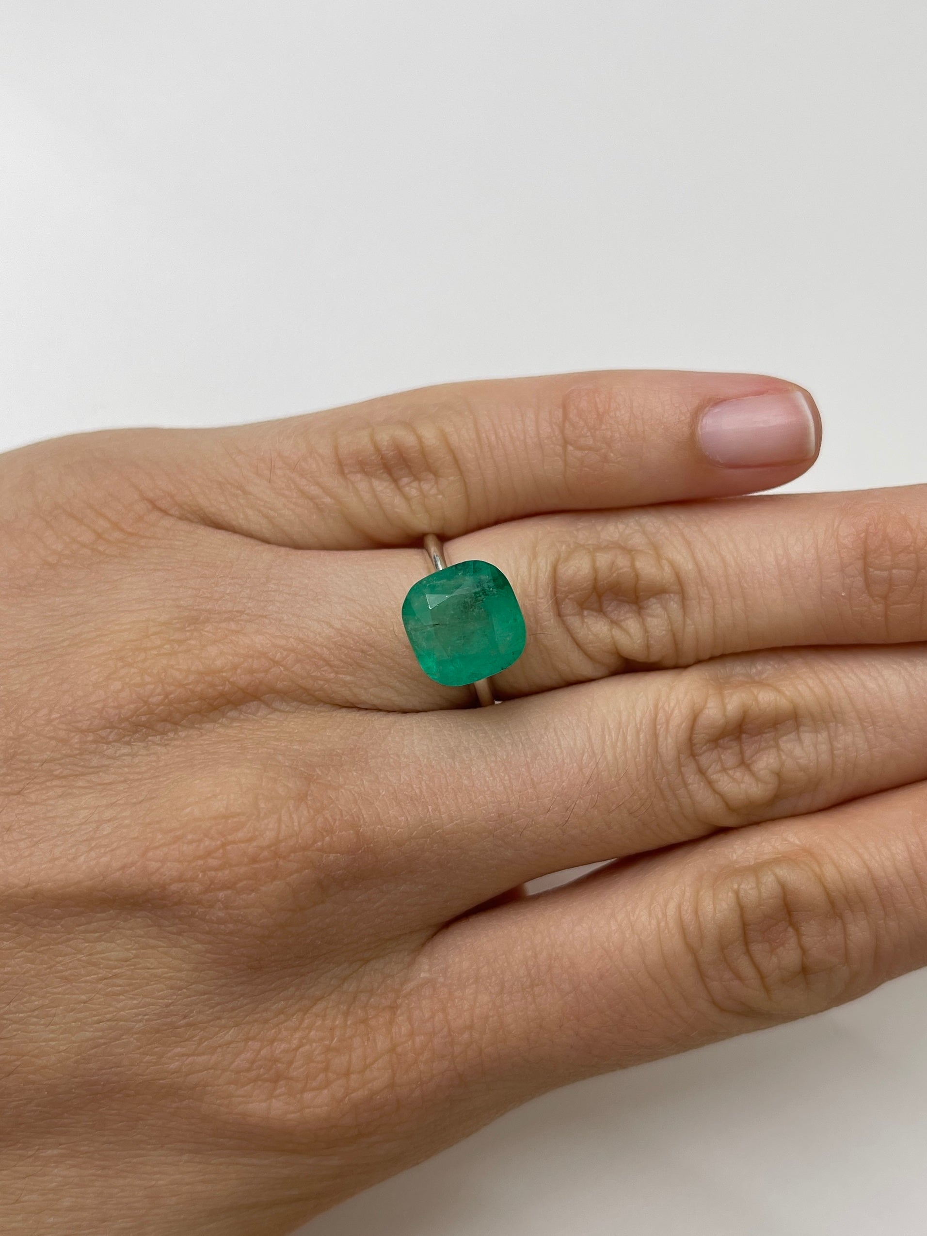 Natural 5.33 carat Colombian emerald loose gemstone with cushion cut, earthy green color, from JR Colombian Emeralds.