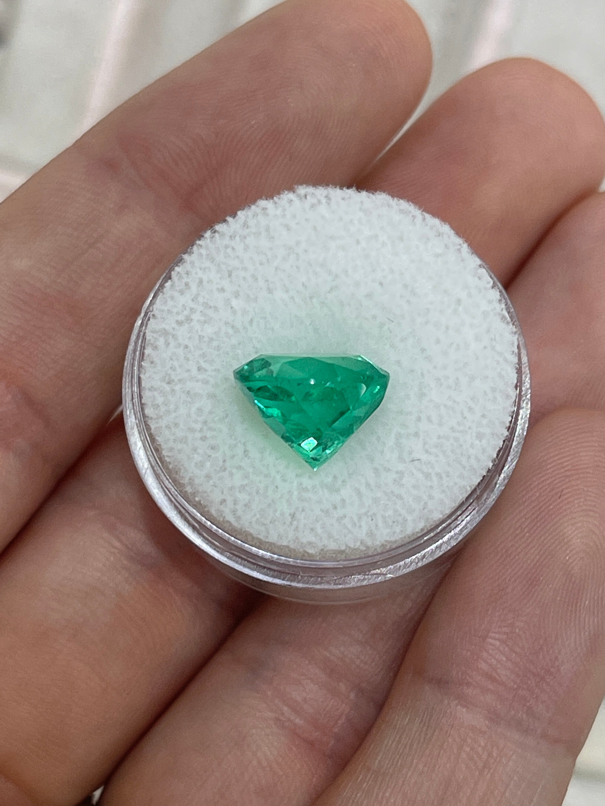 Vibrant green 5.48 carat natural round Colombian emerald gemstone with gemstone cut and clarity, from JR Colombian Emeralds.