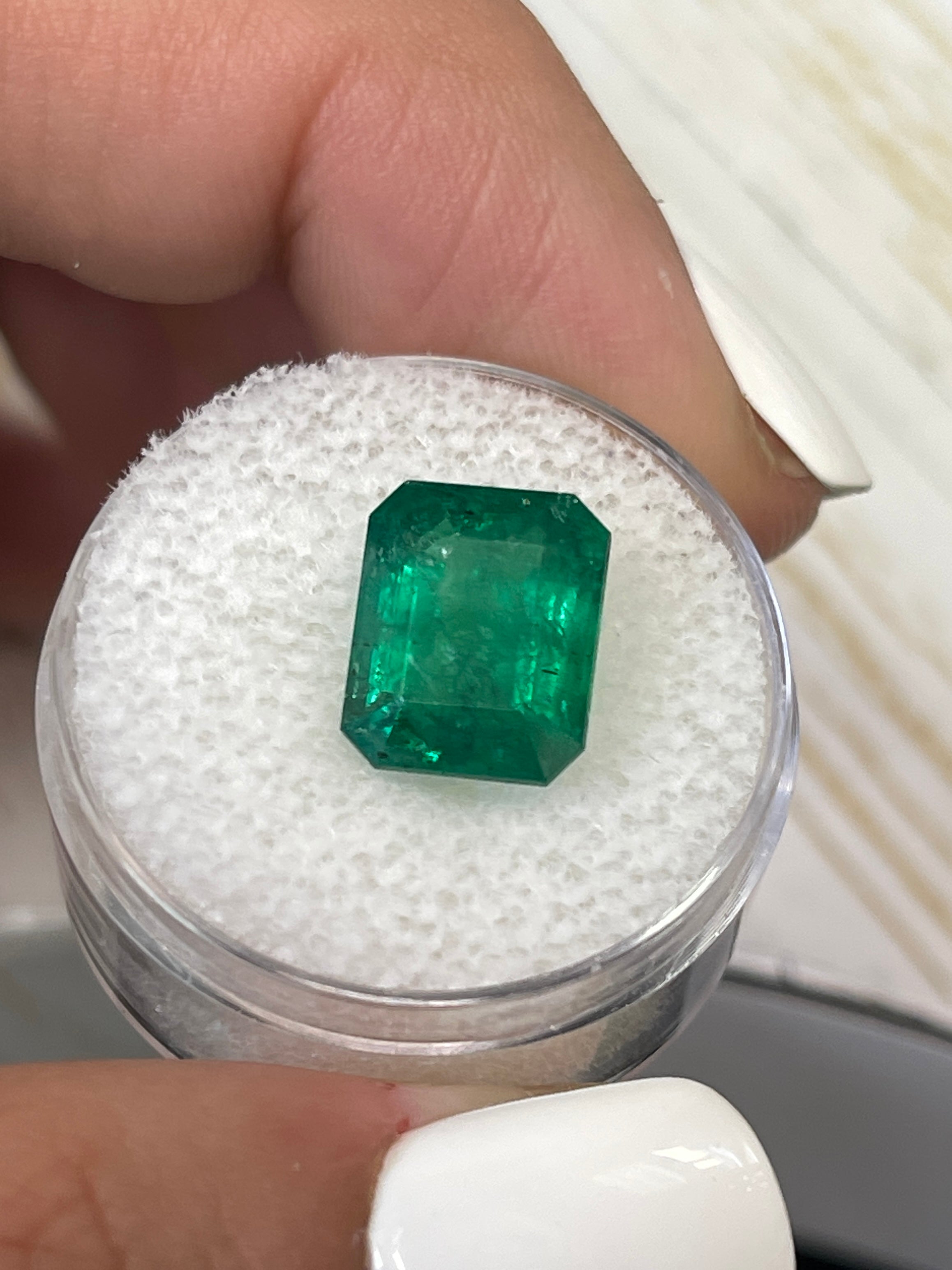 Natural 5.68 carat medium deep green Zambian emerald cut loose gemstone from JR Colombian Emeralds.