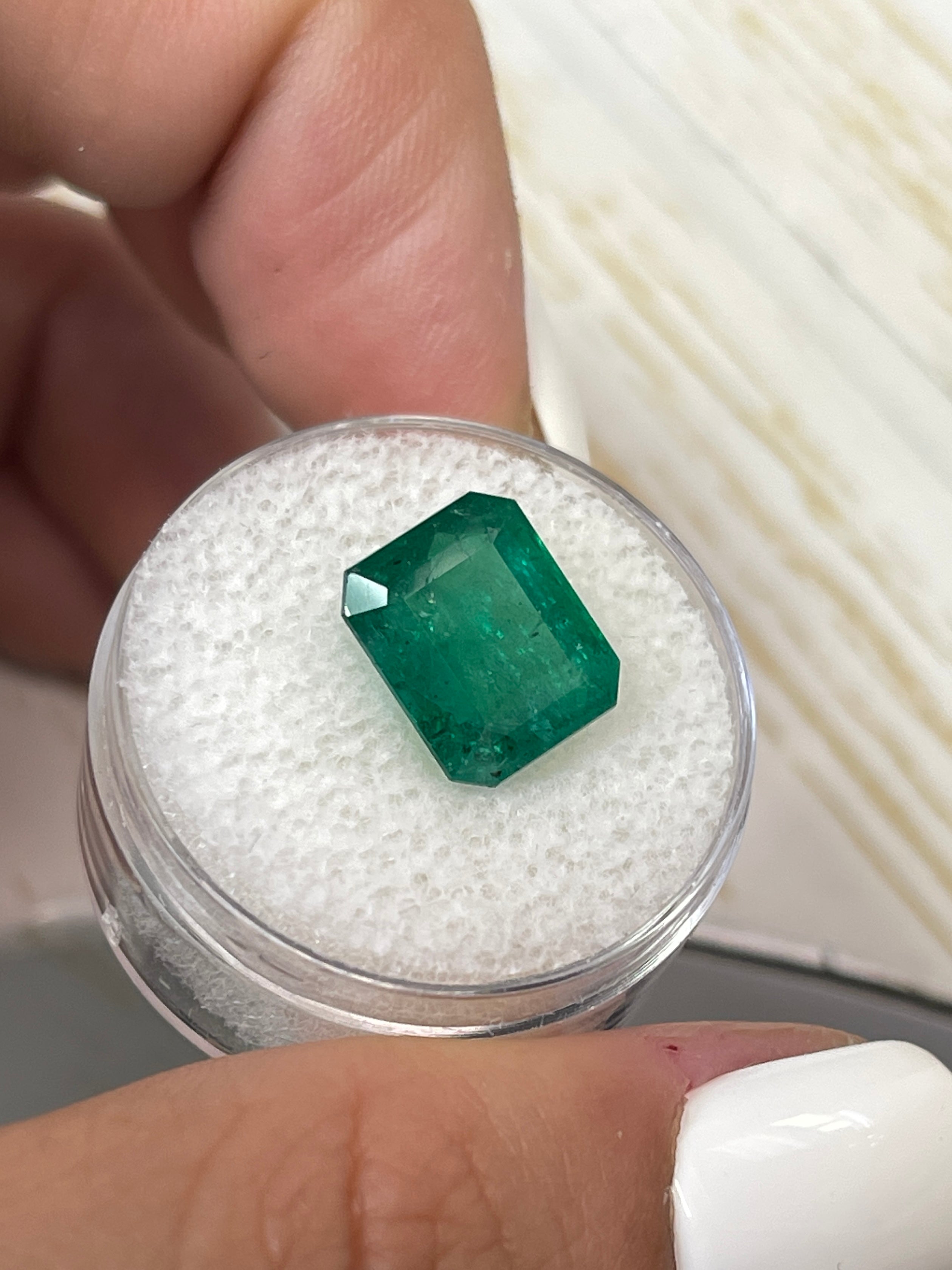 Medium deep green 5.68 carat Zambian emerald cut natural loose emerald from JR Colombian Emeralds with 11.3x9.3mm size.
