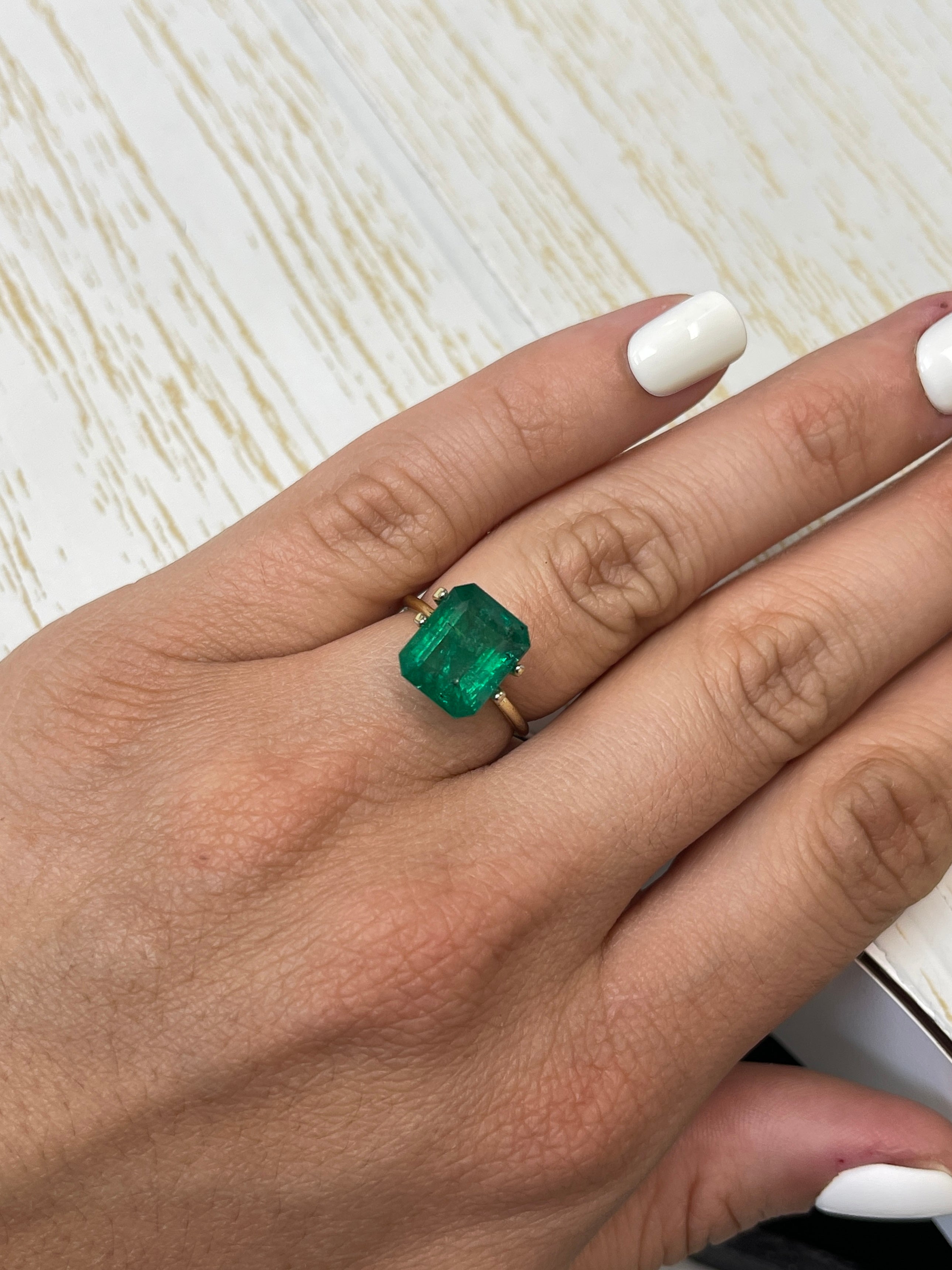 Natural 5.68 carat medium deep green Zambian emerald cut loose emerald from JR Colombian Emeralds, 11.3x9.3 mm.