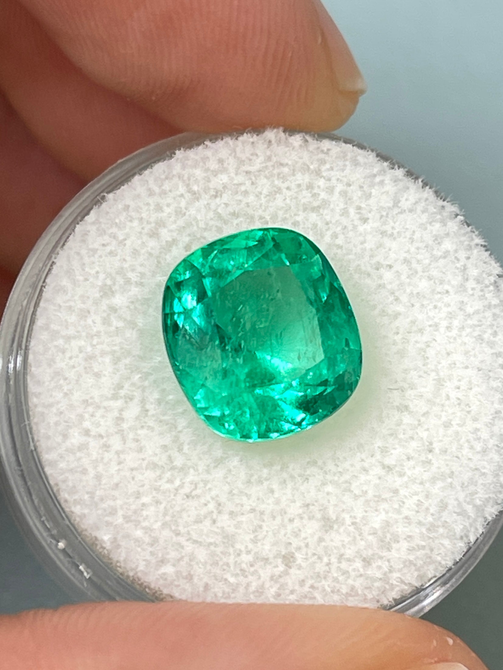 Vivid bluish-green 5.72 carat Colombian emerald loose cushion cut gemstone from JR Colombian Emeralds.