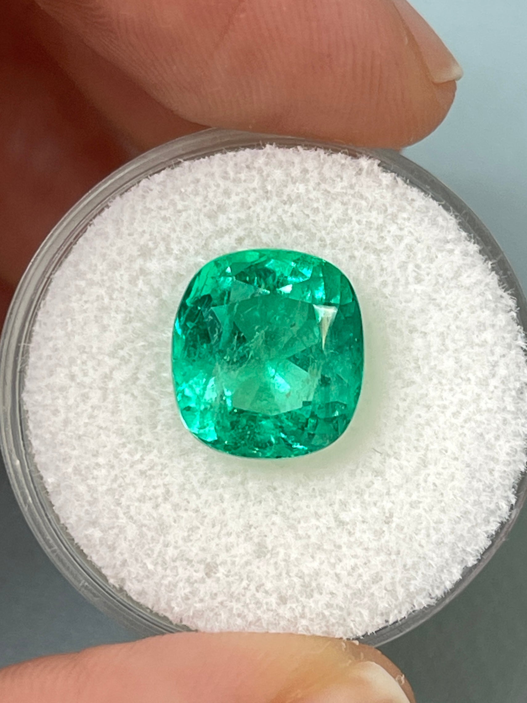 Vivid bluish green 5.72 carat natural Colombian emerald in cushion cut, loose gemstone from JR Colombian Emeralds.