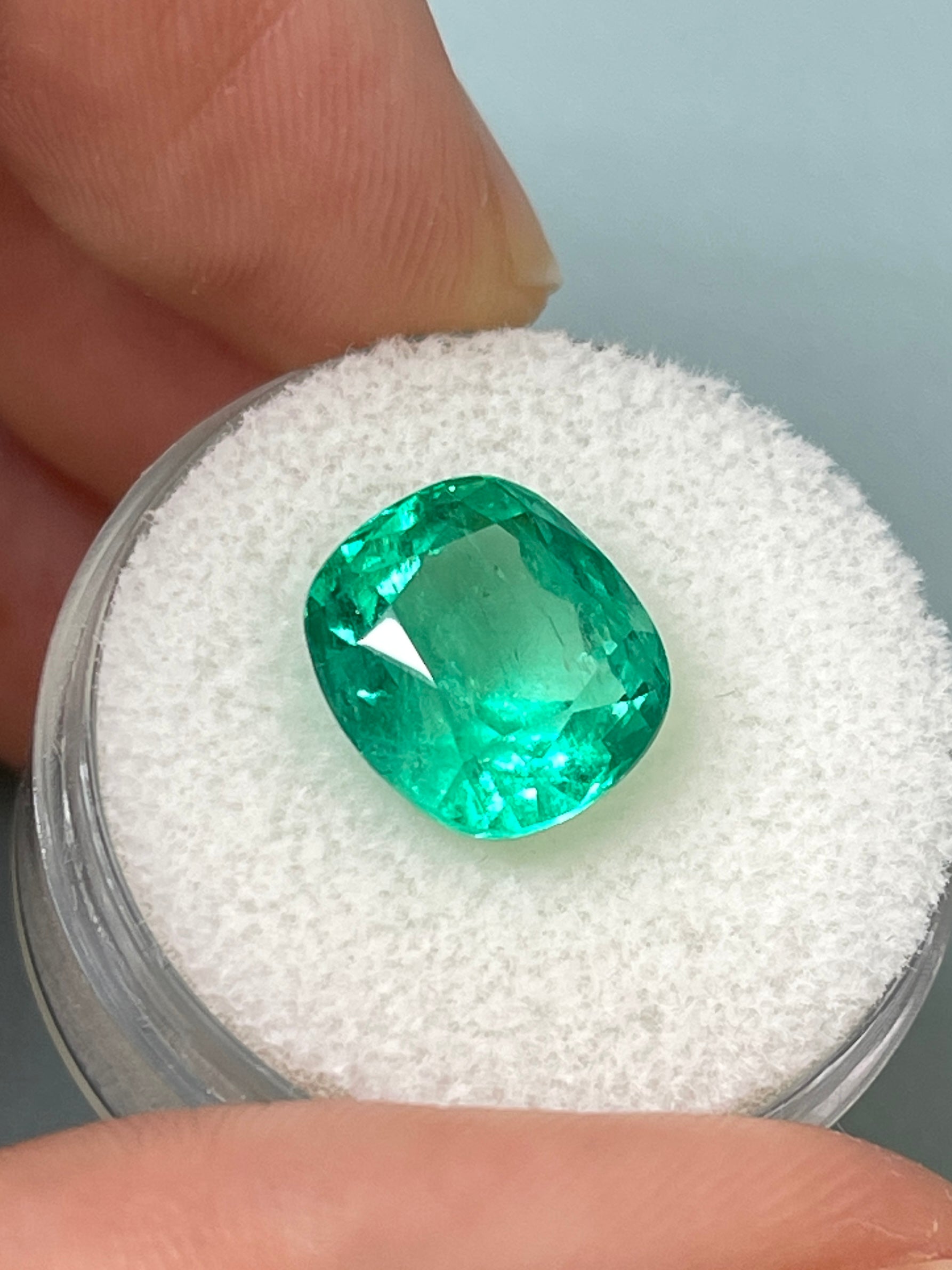 Vivid bluish green 5.72 carat natural Colombian emerald loose cushion cut gemstone from JR Colombian Emeralds.