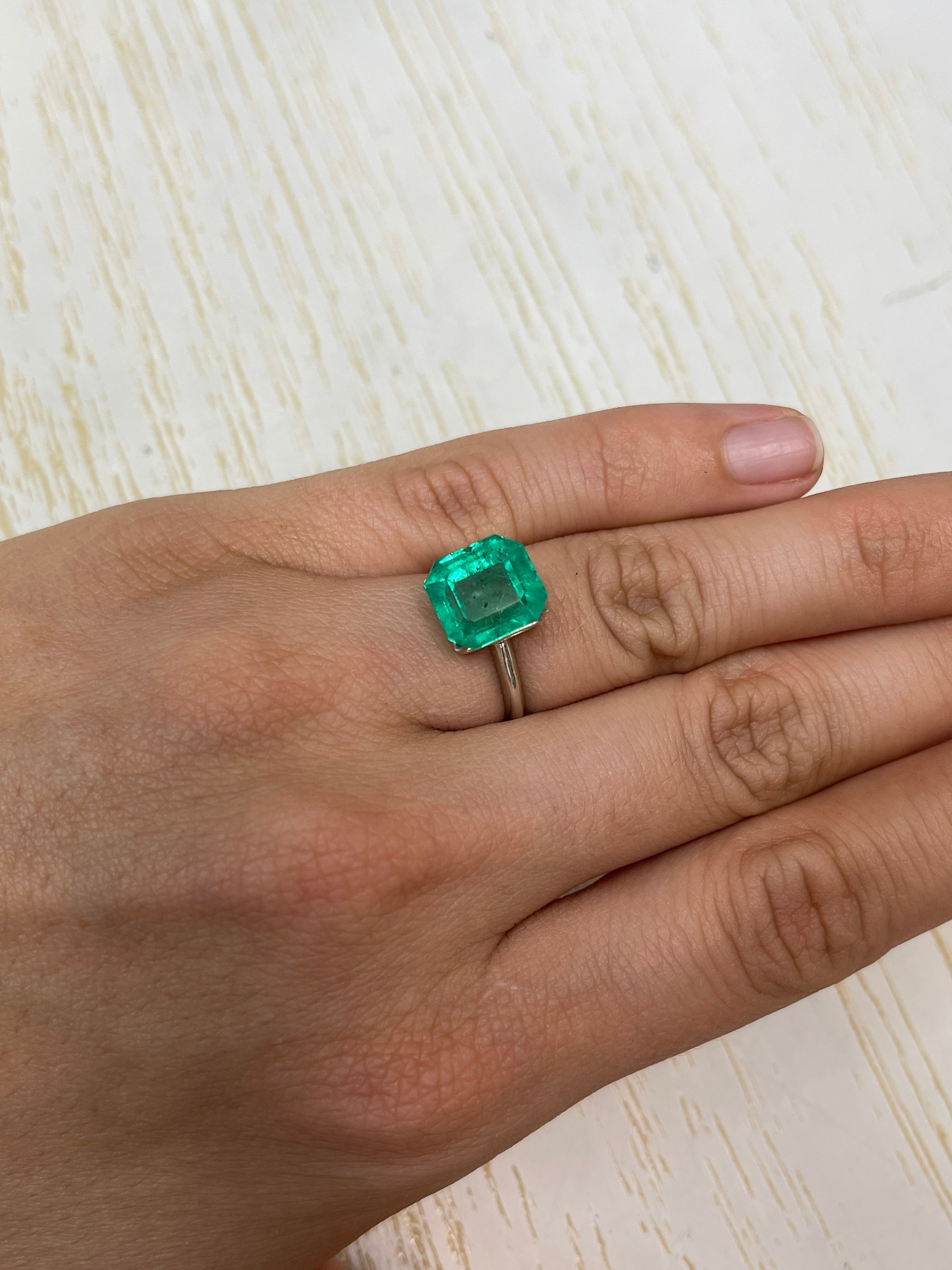 Natural 5.72 carat Colombian emerald loose gemstone with freckled forest green color, Asscher cut, from JR Colombian Emeralds.