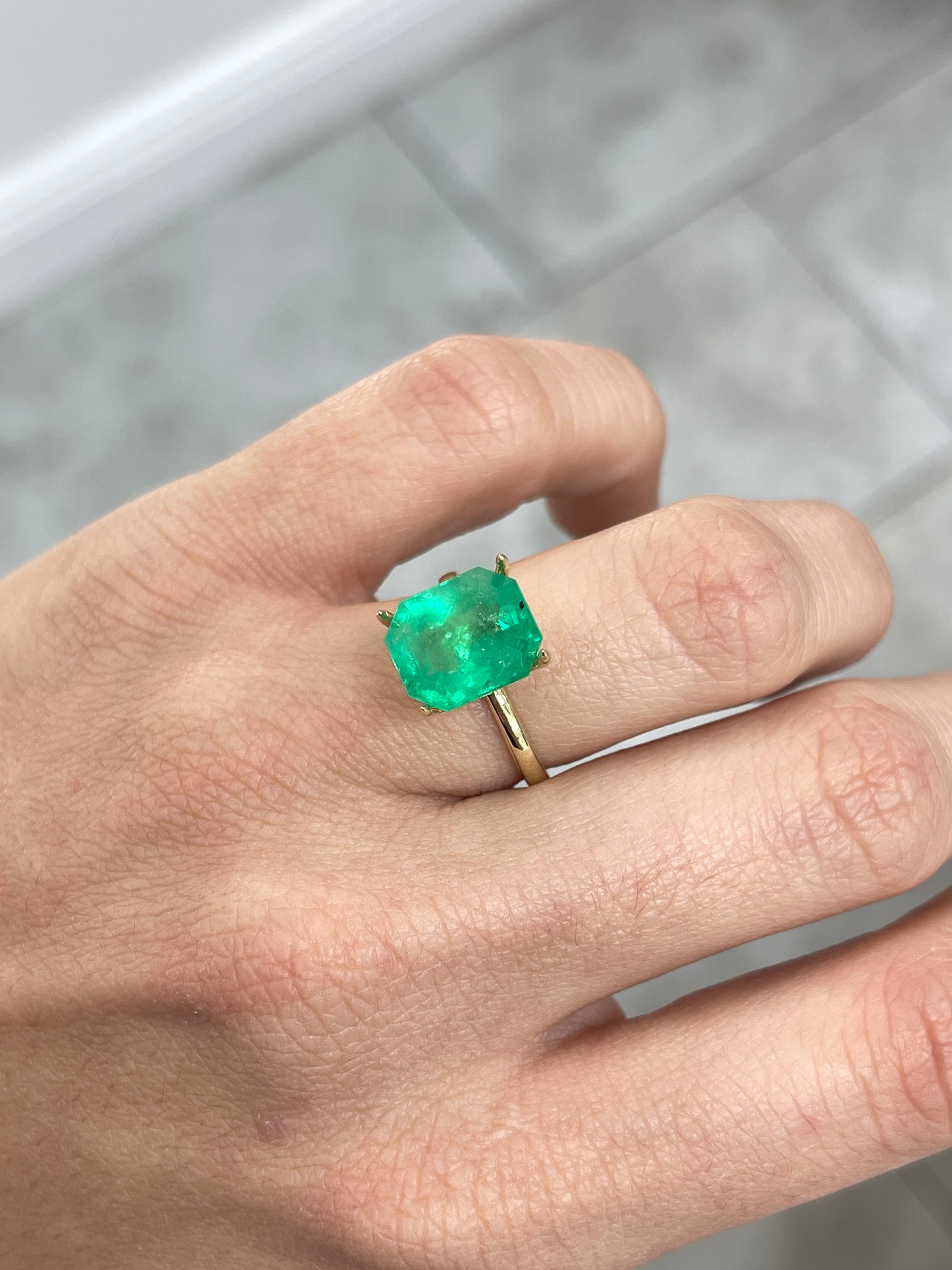 Natural loose Colombian emerald, 5.75 carats, emerald cut, medium green, freckled, from JR Colombian Emeralds.