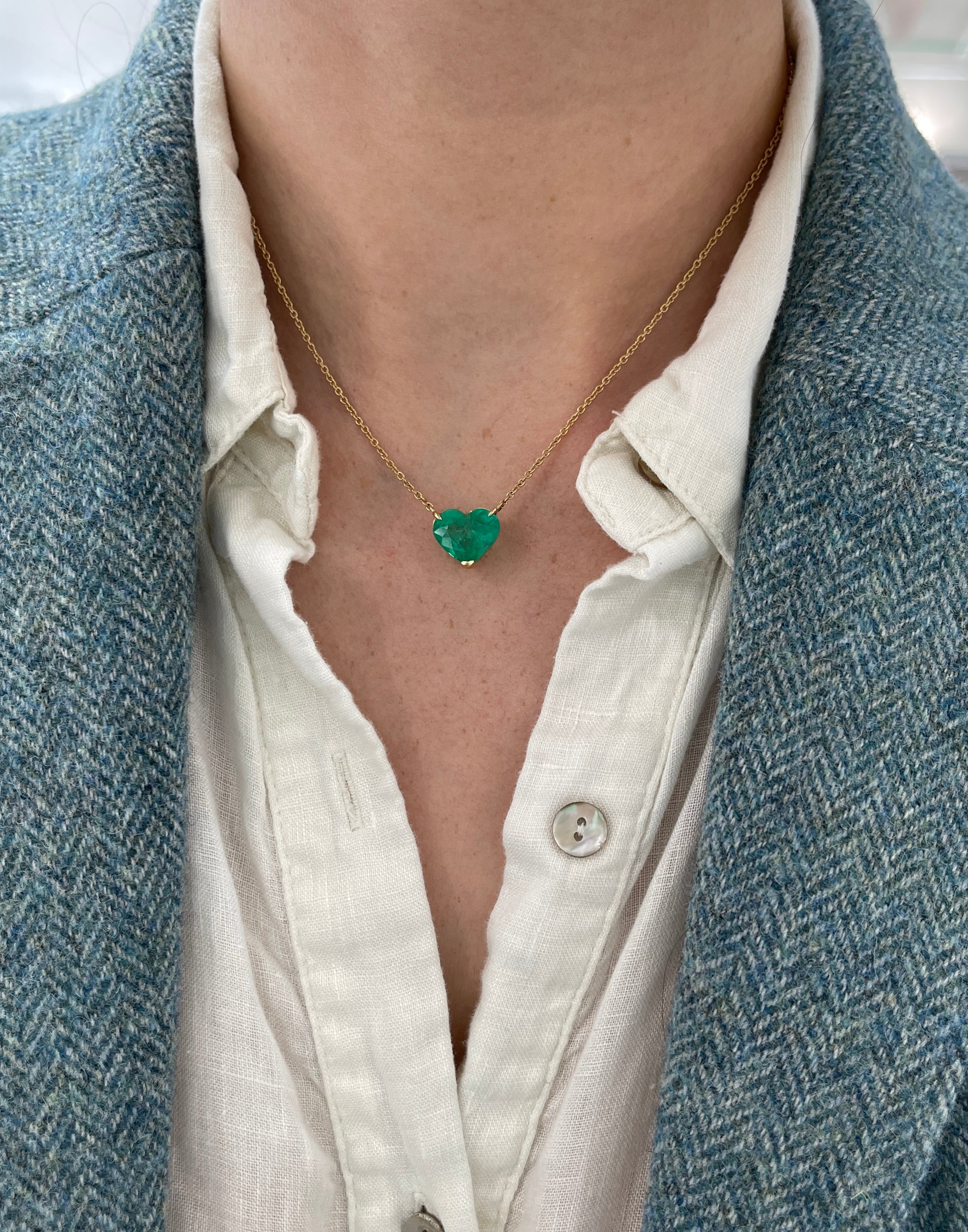 Colombian emerald heart-cut solitaire necklace by JR Colombian Emeralds featuring a 5.77-carat pendant on 18K chain