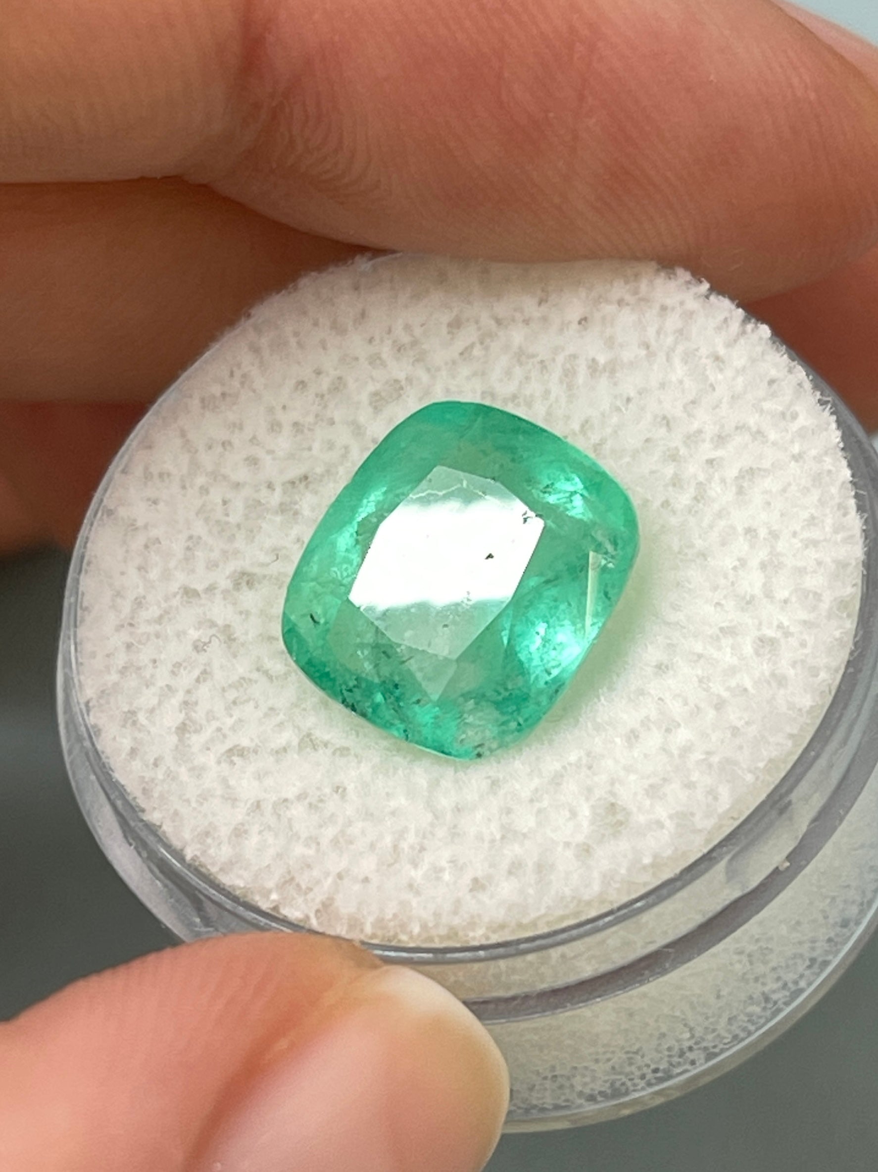 5.86 carat natural Colombian emerald, cushion cut, earthy pastel green, loose gemstone from JR Colombian Emeralds.