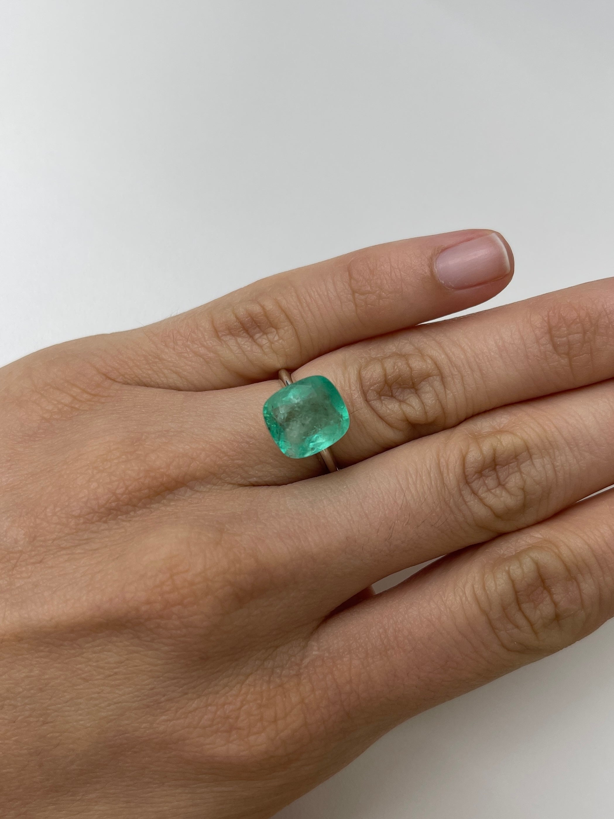 5.86 carat natural Colombian emerald, cushion cut, earthy pastel green, loose gemstone from JR Colombian Emeralds.