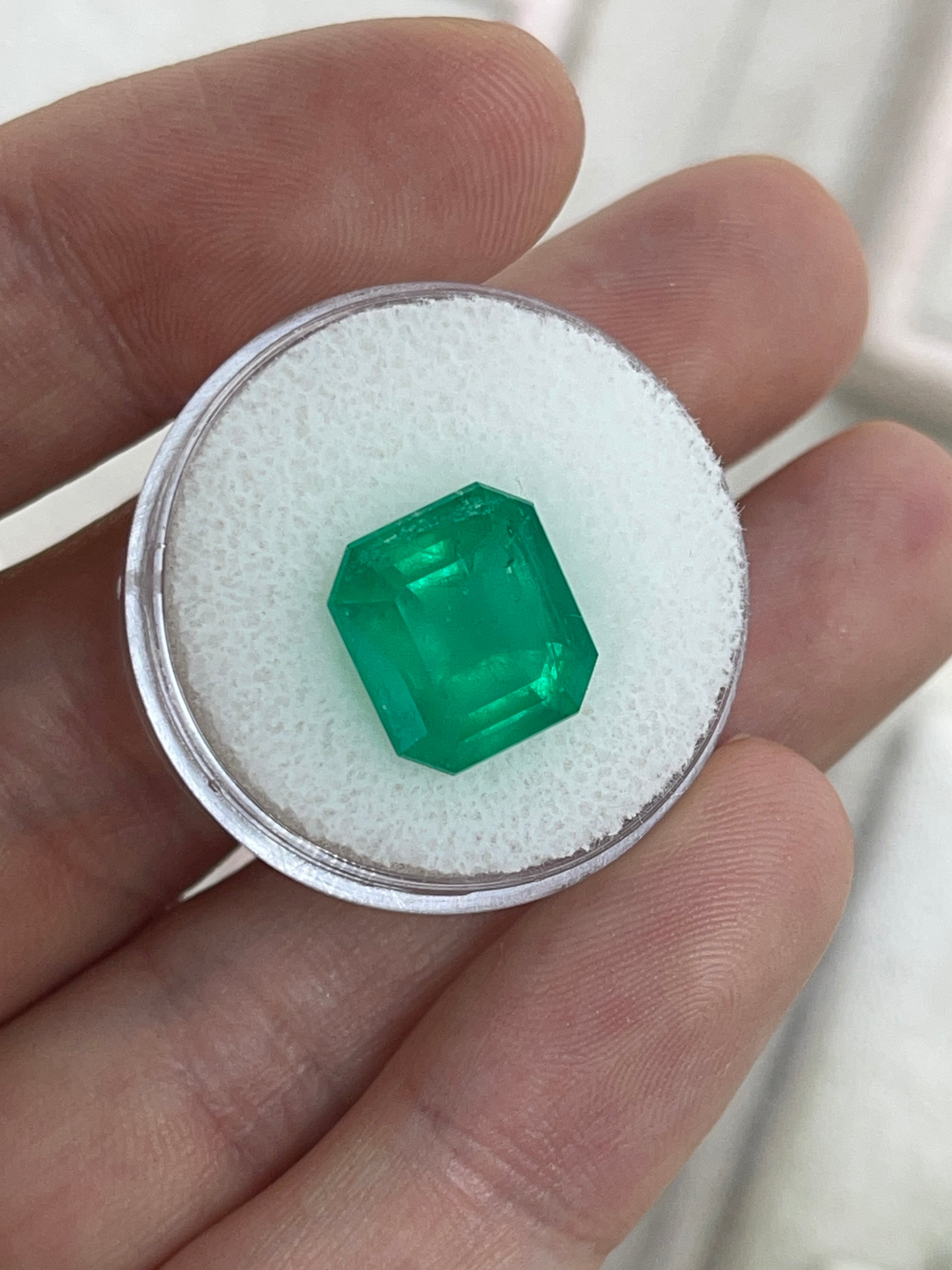 Deep green 5.94 carat natural Colombian emerald in emerald cut, loose gemstone from JR Colombian Emeralds.
