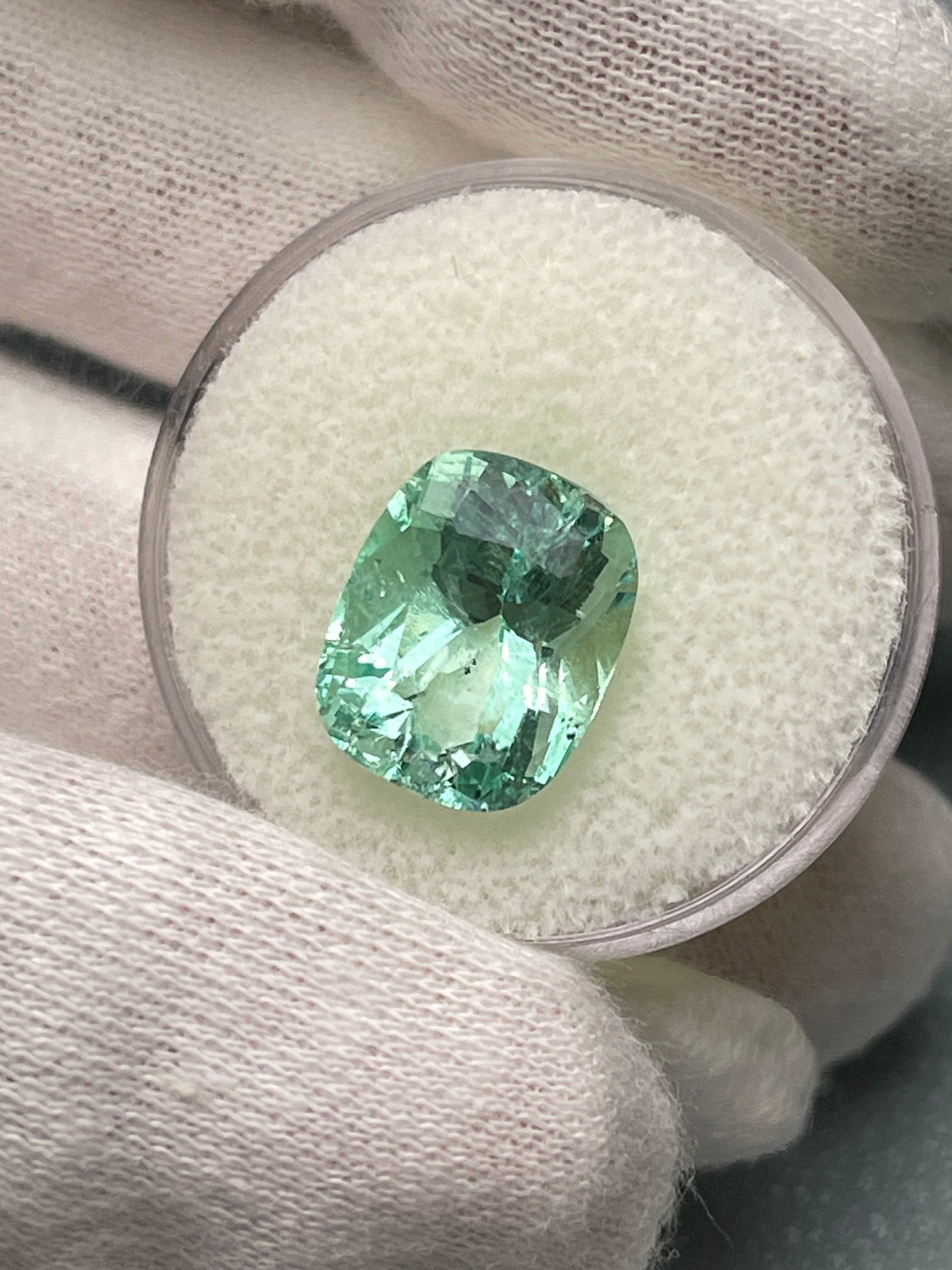 Seafoam green 5.96 carat Colombian emerald with natural freckles, elongated cushion cut, loose gemstone from JR Colombian Emeralds.