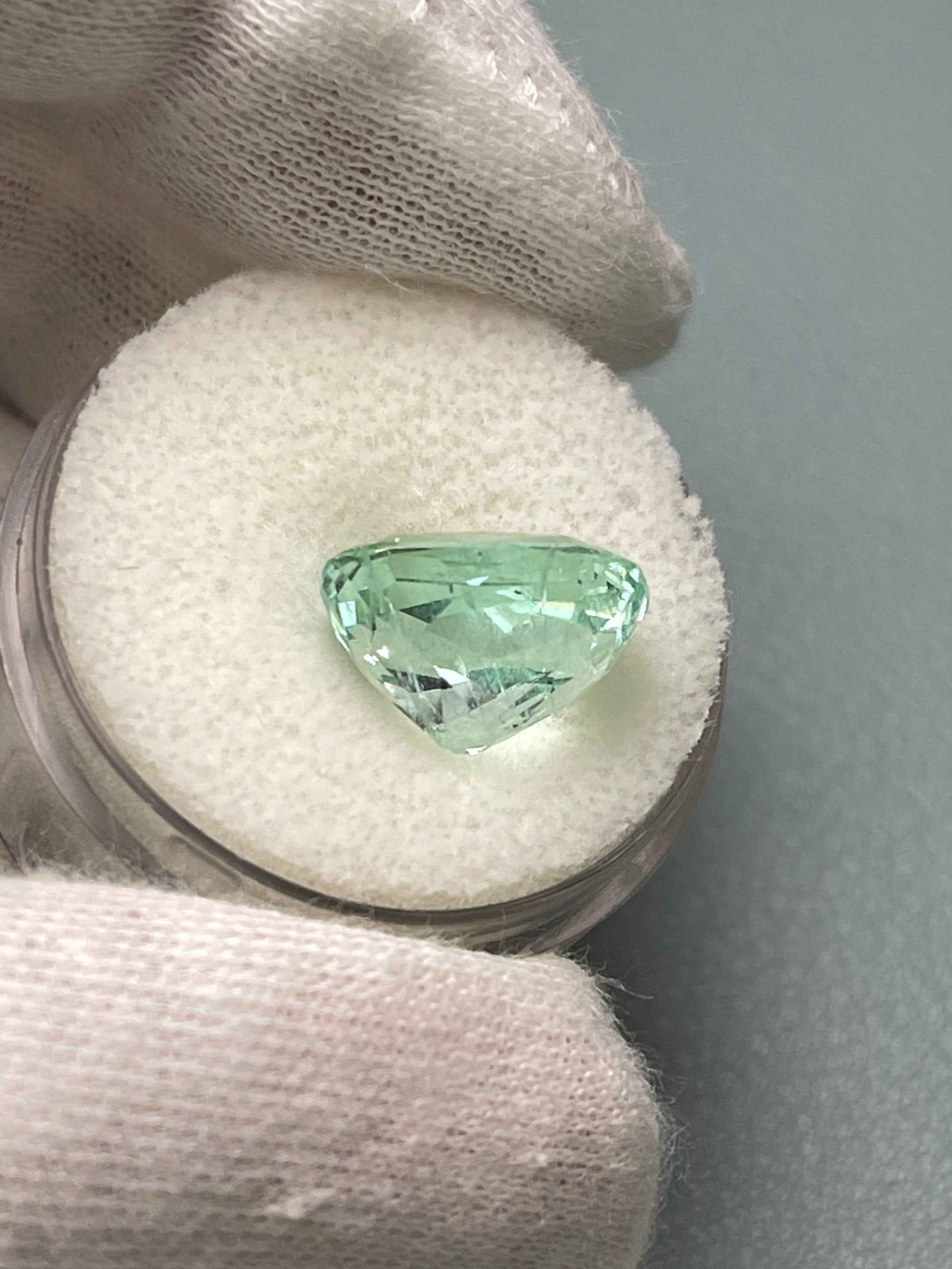 Seafoam green 5.96 carat natural Colombian emerald loose gemstone, elongated cushion cut with natural freckling, by JR Colombian Emeralds.