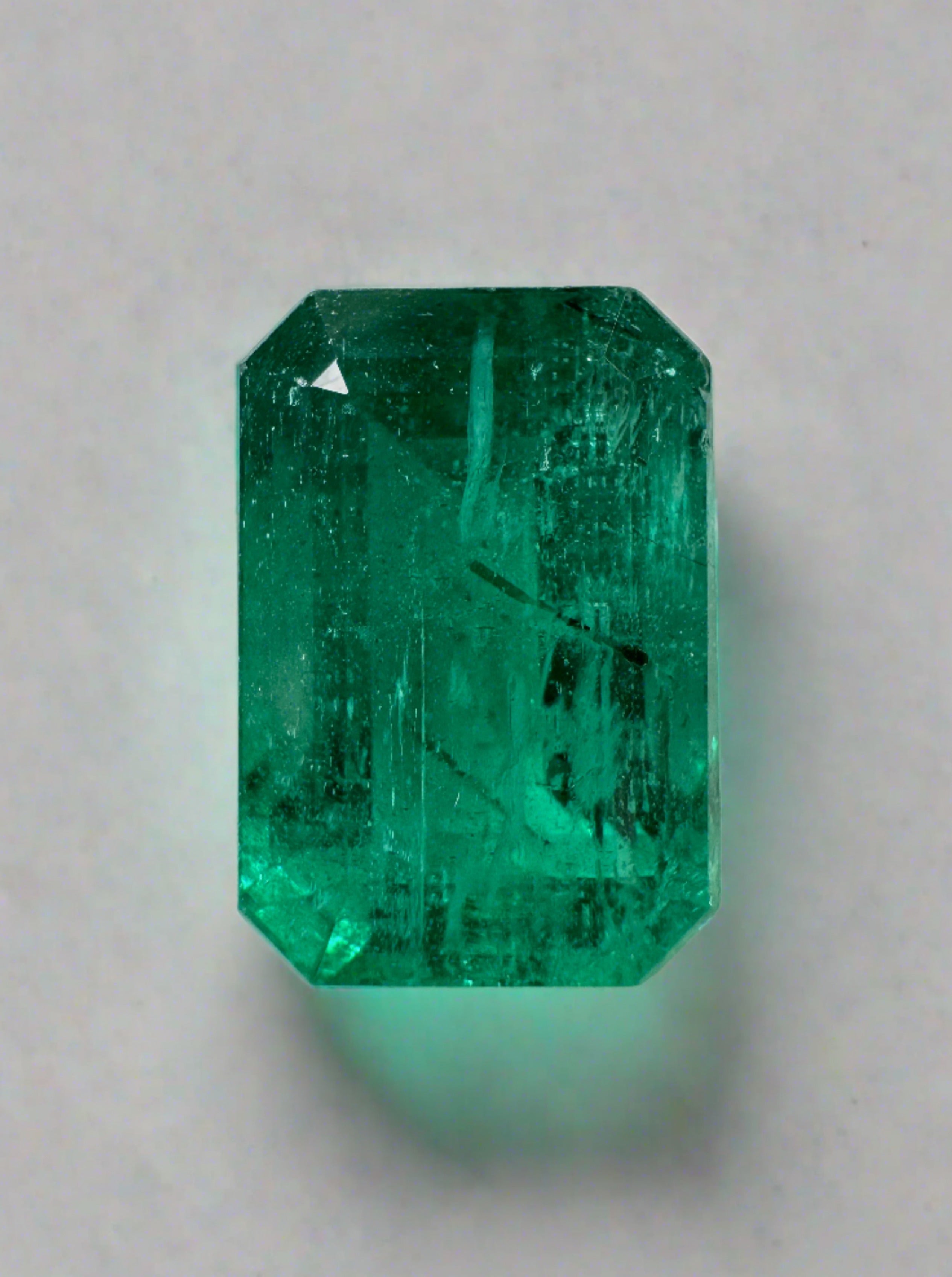 Vivid green 5.97 carat natural Zambian emerald cut loose gemstone from JR Colombian Emeralds.