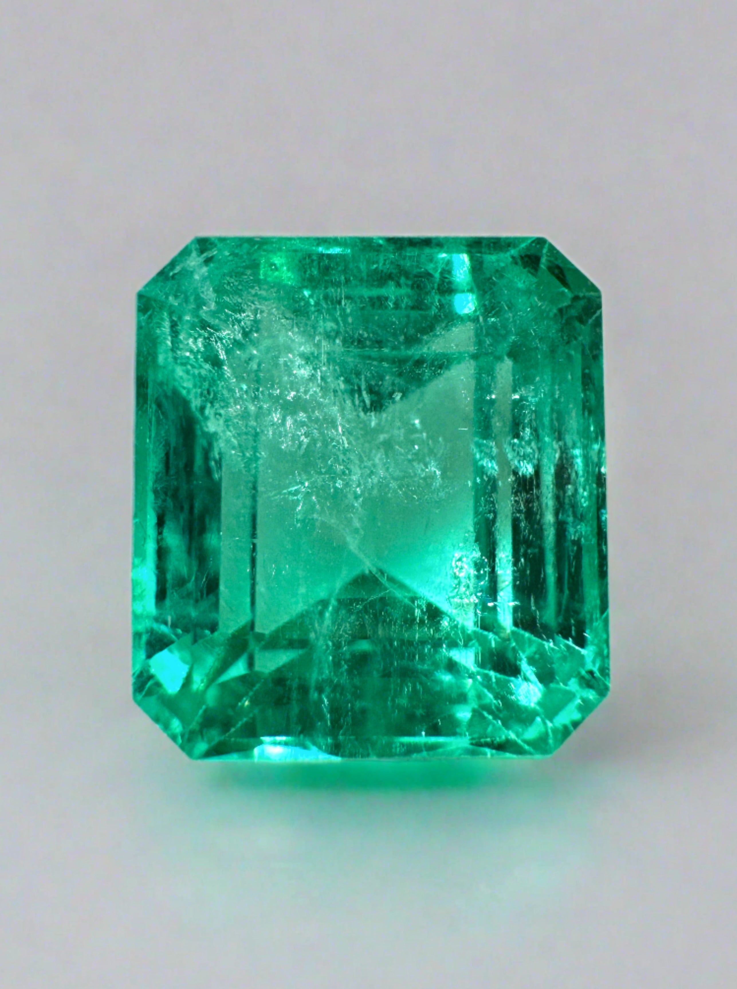 Loose 5.98 carat green Colombian emerald in an emerald cut, crystal-clear and natural, from JR Colombian Emeralds.