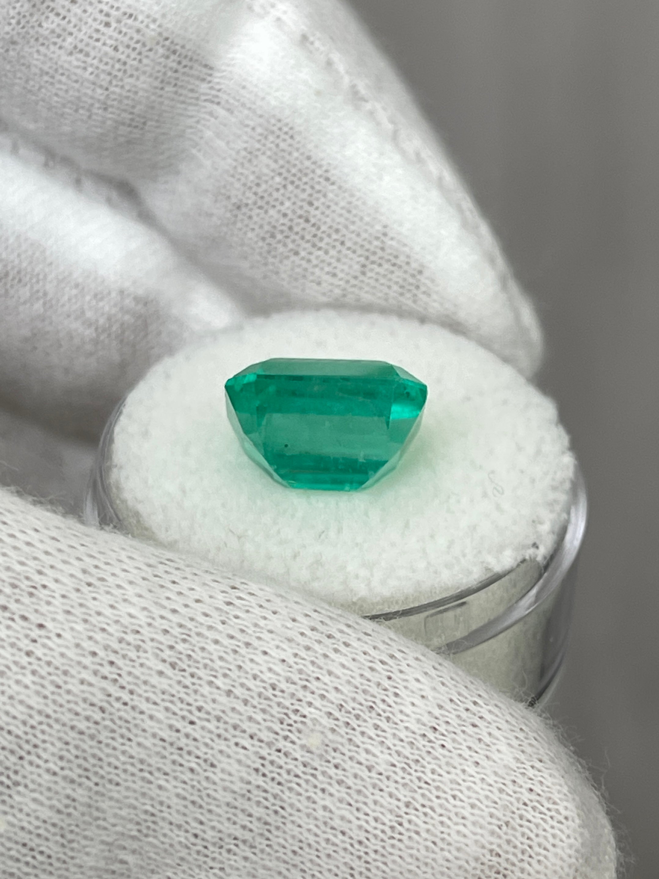 6.03 carat bluish natural Colombian emerald loose gemstone with classic emerald cut, showcasing vibrant color and clarity.