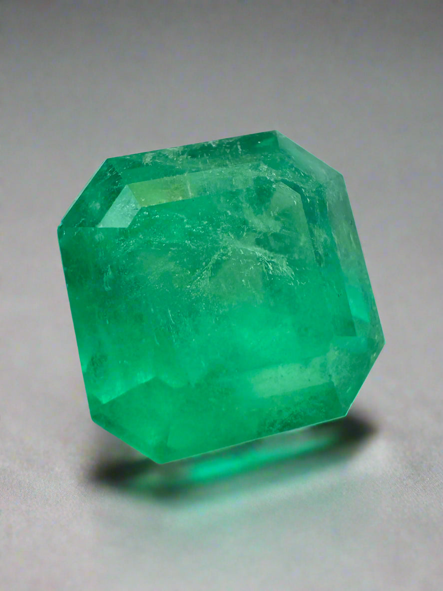 Medium neon yellowish 6.19 carat Colombian emerald Asscher cut loose gemstone, showcasing vibrant color and clarity.