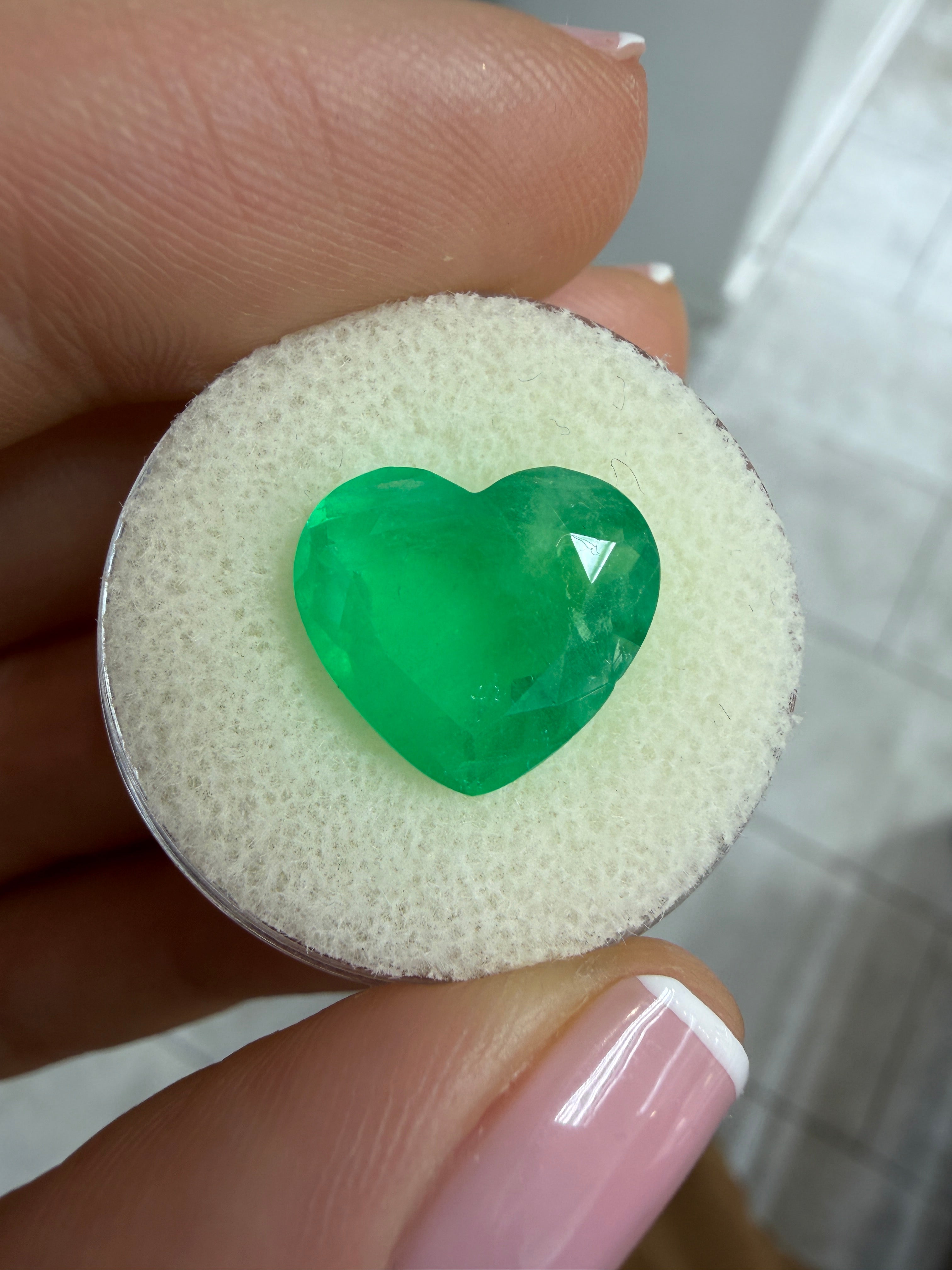 Medium green 6.35 carat Colombian emerald loose gemstone, heart cut, natural and vibrant from JR Colombian Emeralds.