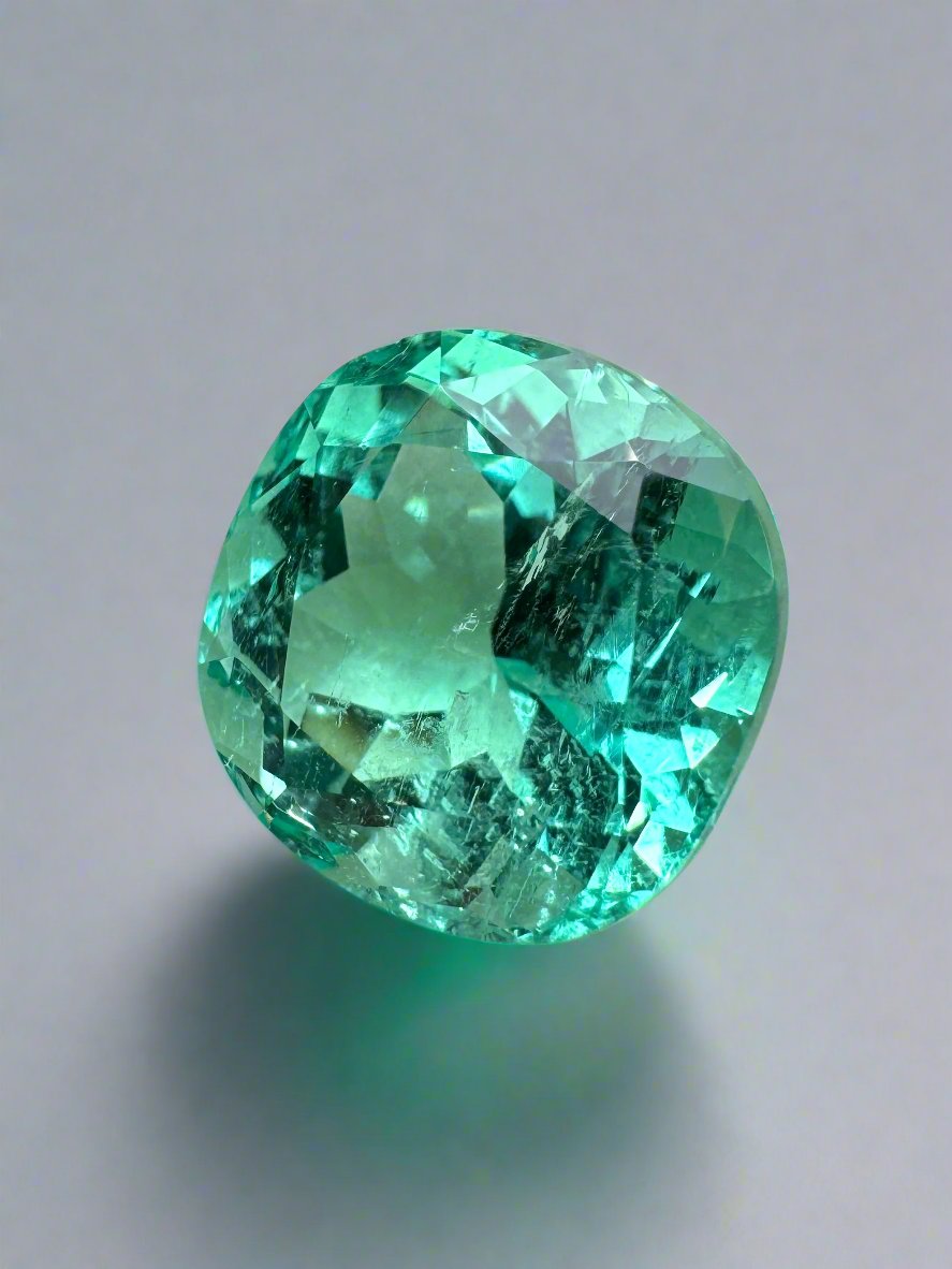 Luminous bluish green 6.38 carat natural Colombian emerald cushion cut loose gemstone from JR Colombian Emeralds.