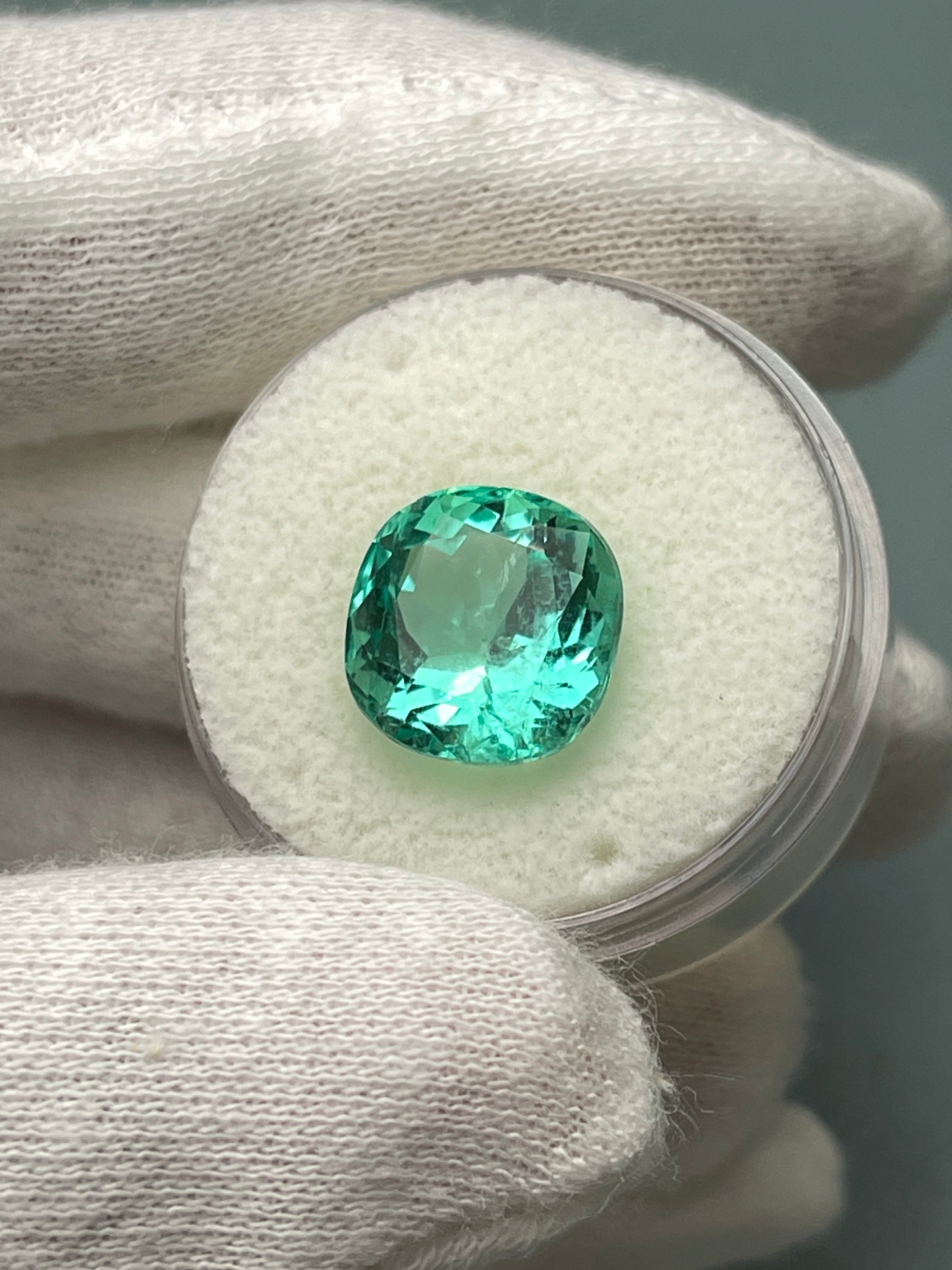 Luminous bluish-green 6.38 carat Colombian emerald loose cushion cut gemstone by JR Colombian Emeralds.