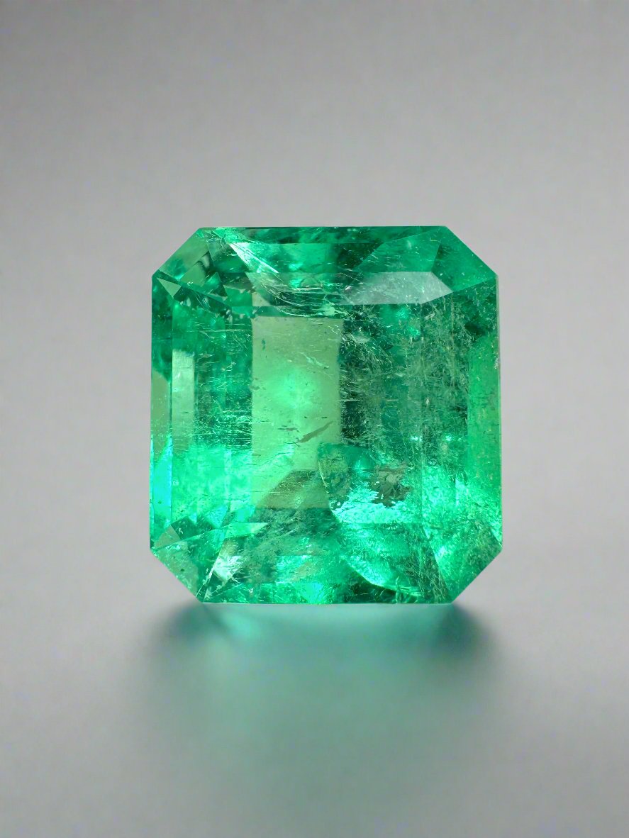 6.50 carat yellowish green natural Colombian emerald loose Asscher cut gemstone, showcasing clarity and vibrant color.