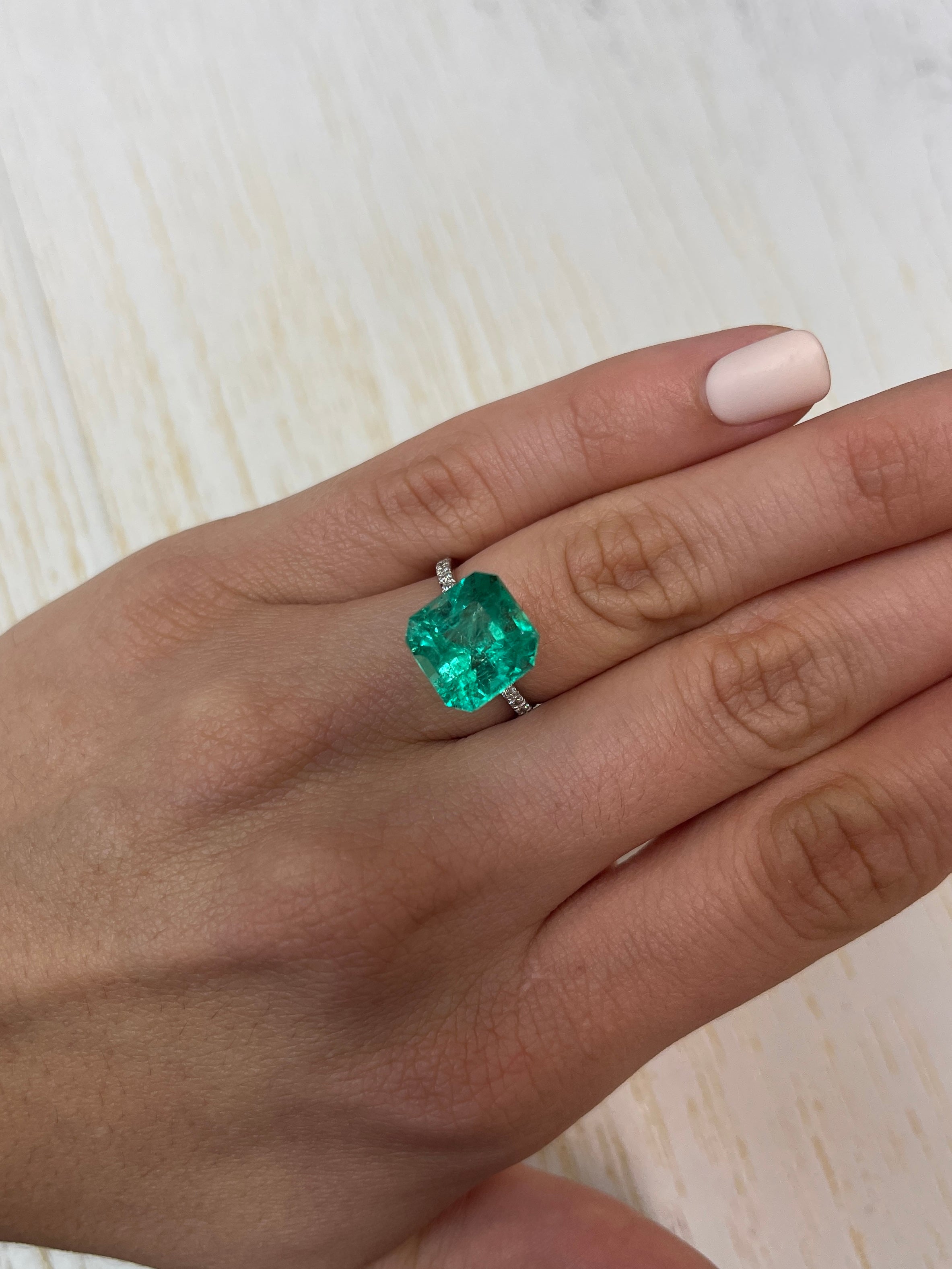 Vivid Muzo green Colombian emerald loose gemstone, 6.69 carats, 11.5x11.5mm Asscher cut, natural and vibrant color.