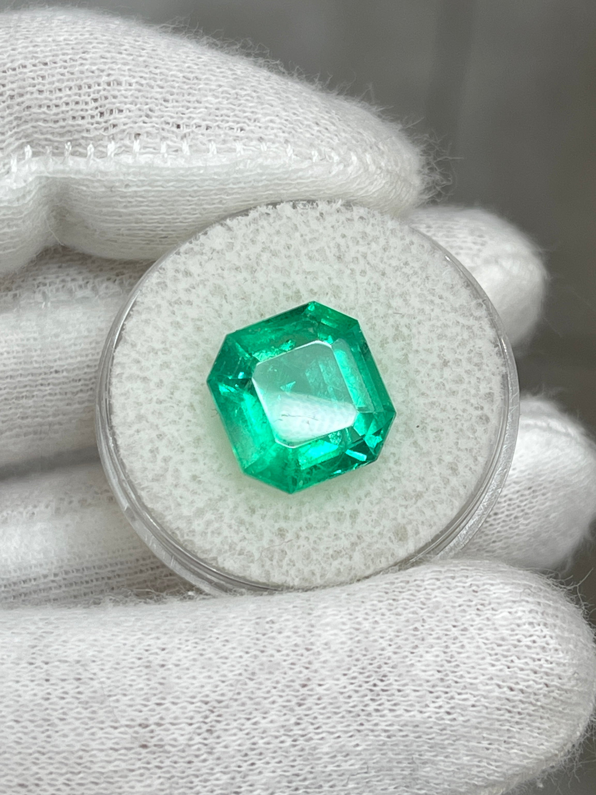6.76 carat glowing green natural Colombian emerald loose gemstone in Asscher cut, displayed on a neutral background.