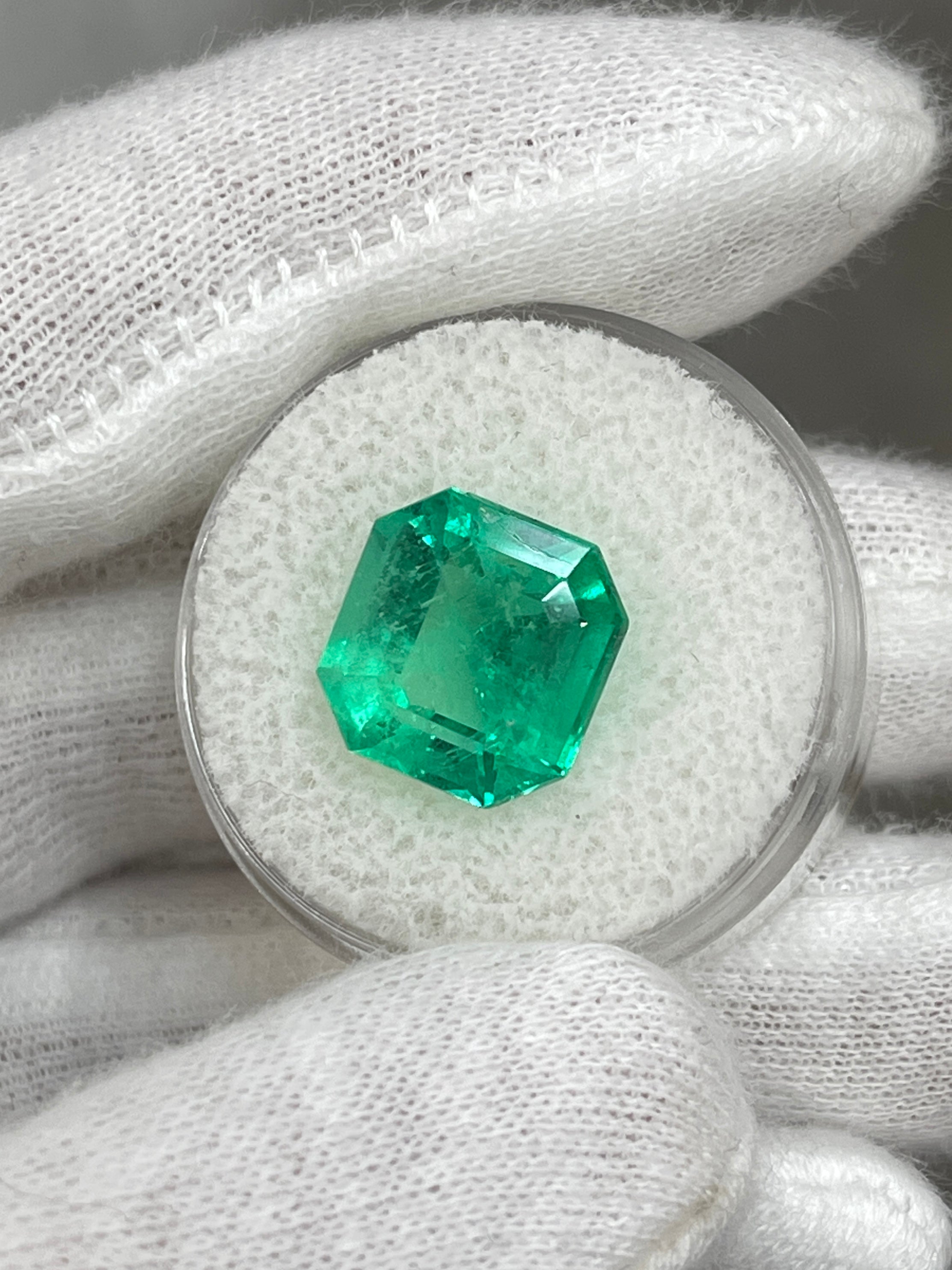 6.76 carat glowing green Colombian emerald loose gemstone in Asscher cut, natural and radiant, from JR Colombian Emeralds.